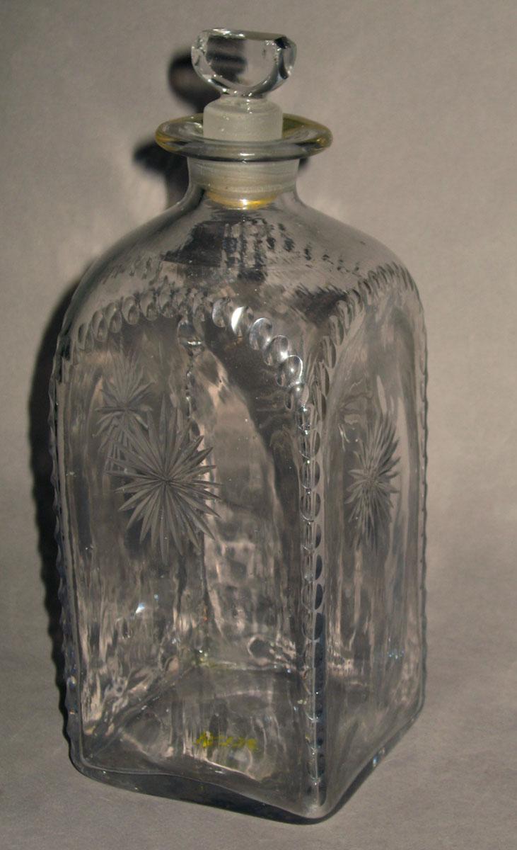 1965.0073 F Colorless glass case bottle