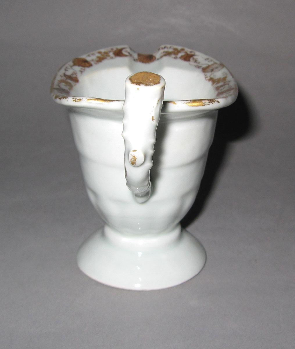 1965.0557.003 Porcelain cream jug handle