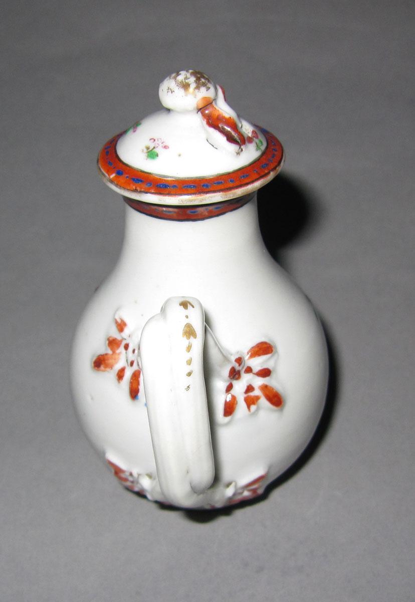 1965.0559.002 A, B Porcelain cream pot handle