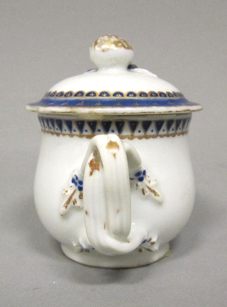 1965.0707.004 A,B Porcelain pot de creme handle