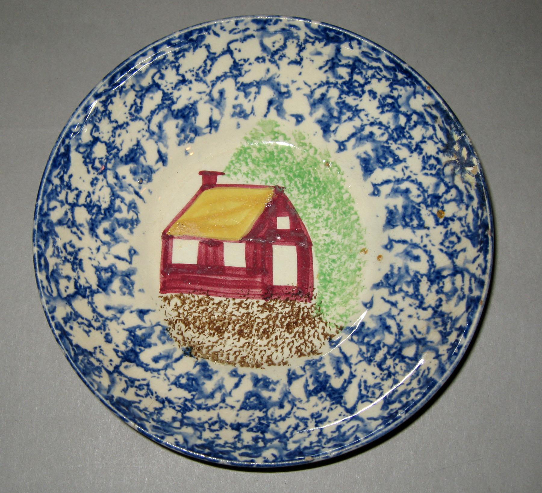 1965.0786 Schoolhouse pattern blue spatterware saucer