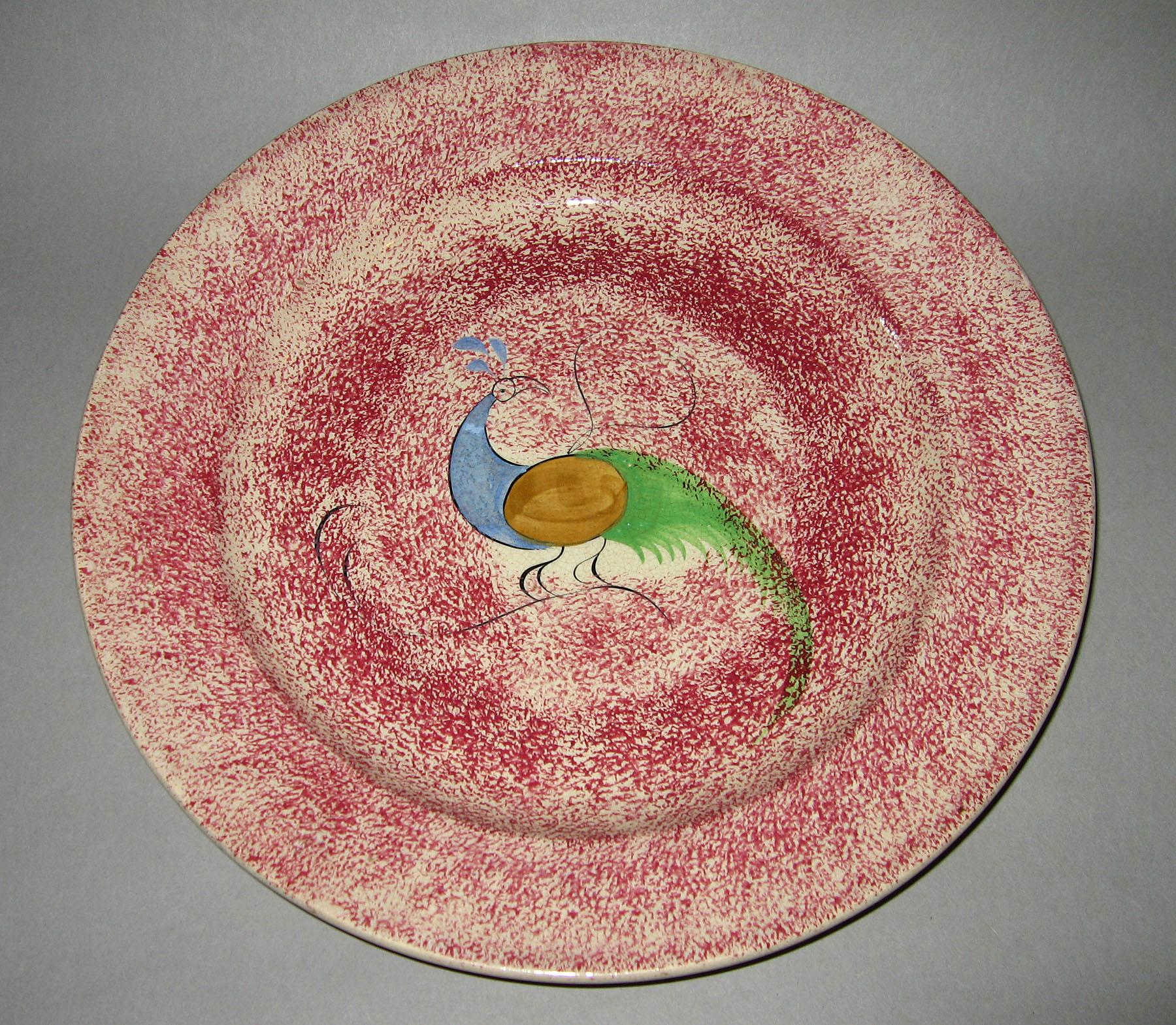 1965.0876.001 Pink spatterware peafowl plate