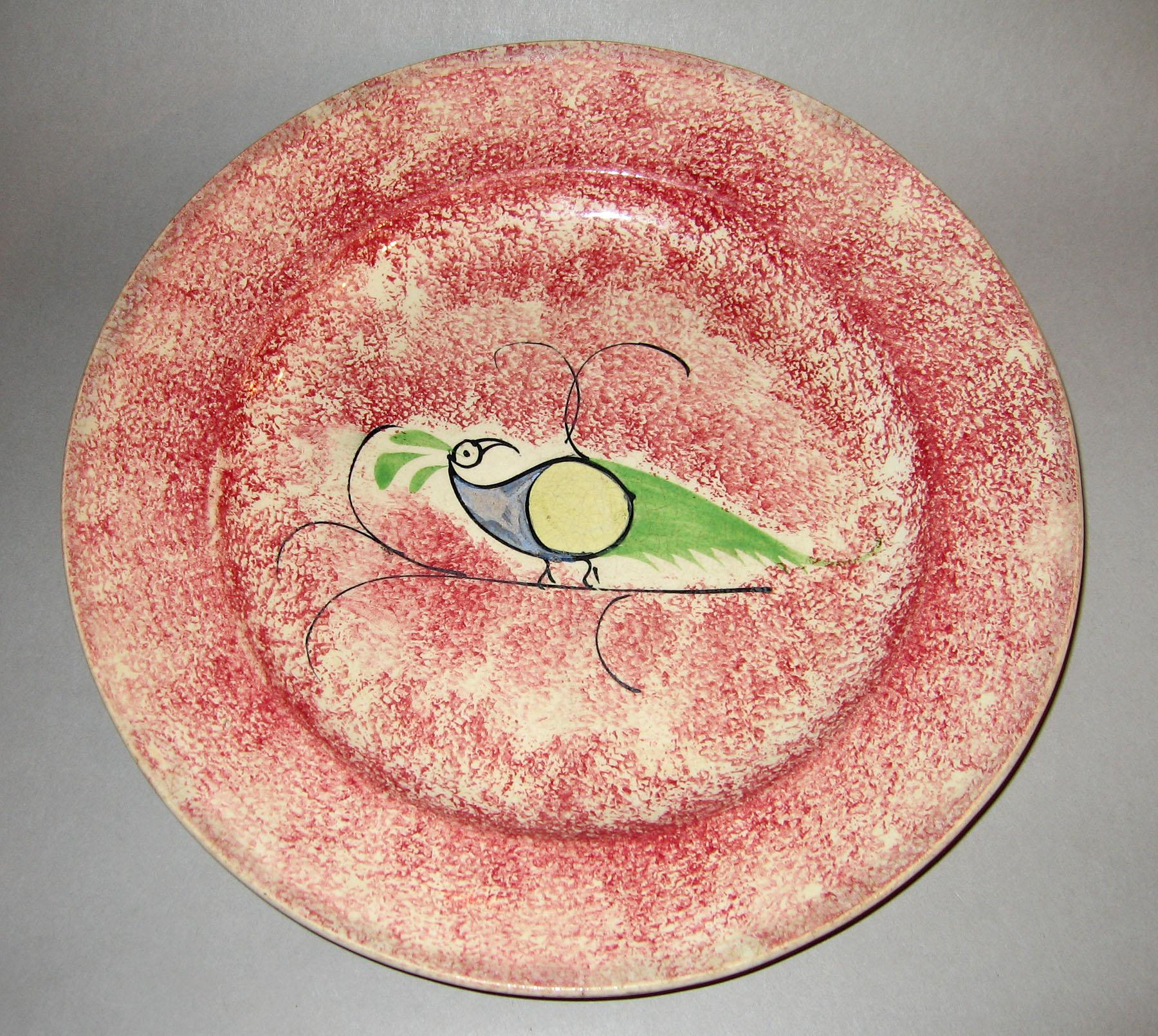 1965.0877.001 Pink spatterware peafowl plate
