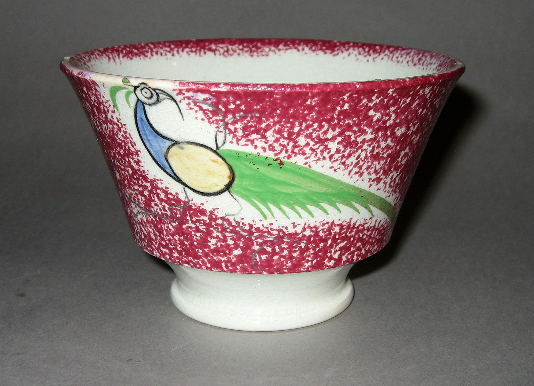 1965.0887.002 Pink spatterware peafowl teabowl
