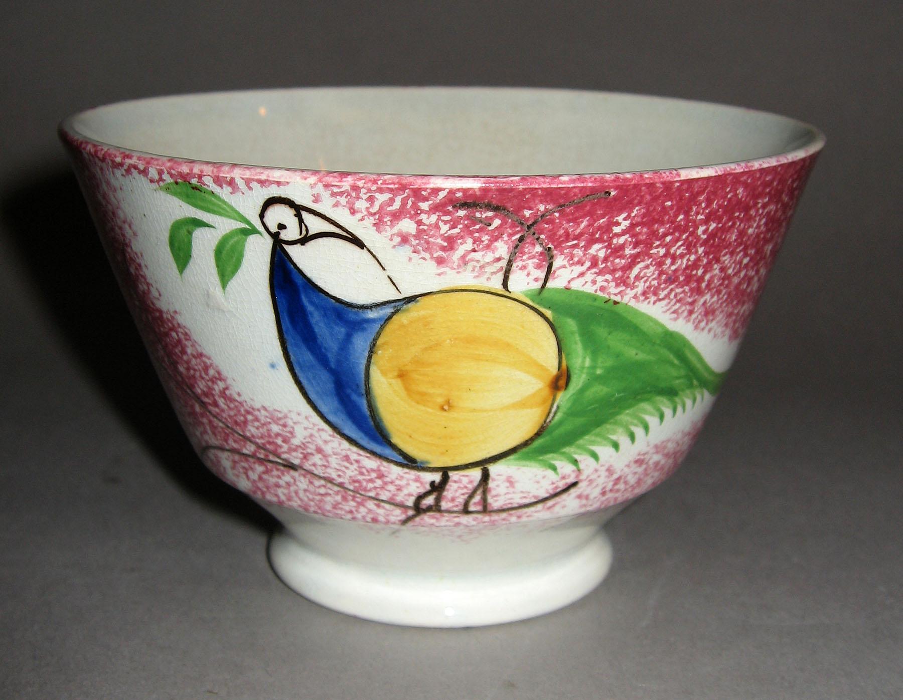 1965.0888 Pink spatterware peafowl teabowl