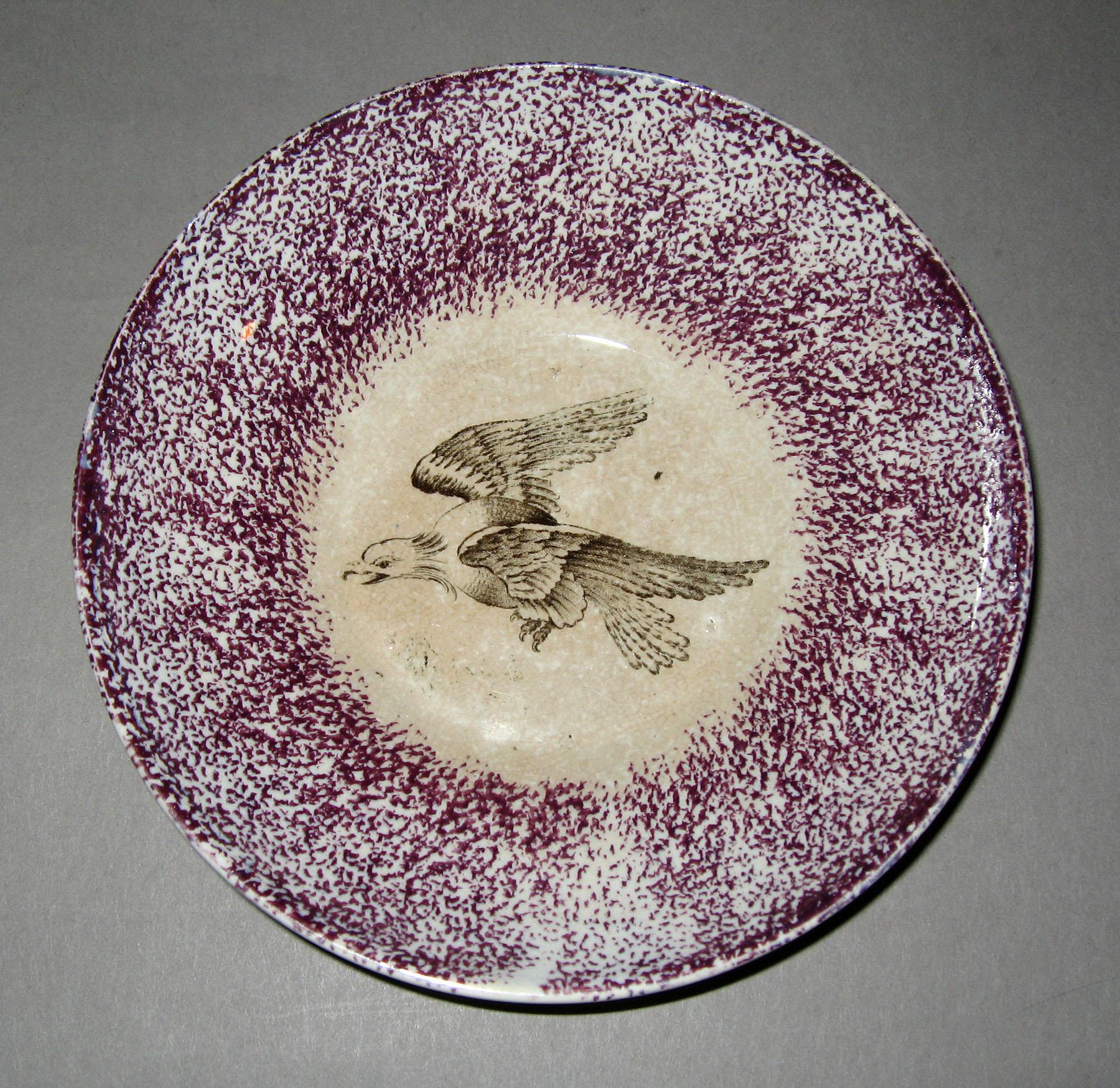 1965.0910.002 Eagle in flight purple spatterware saucer
