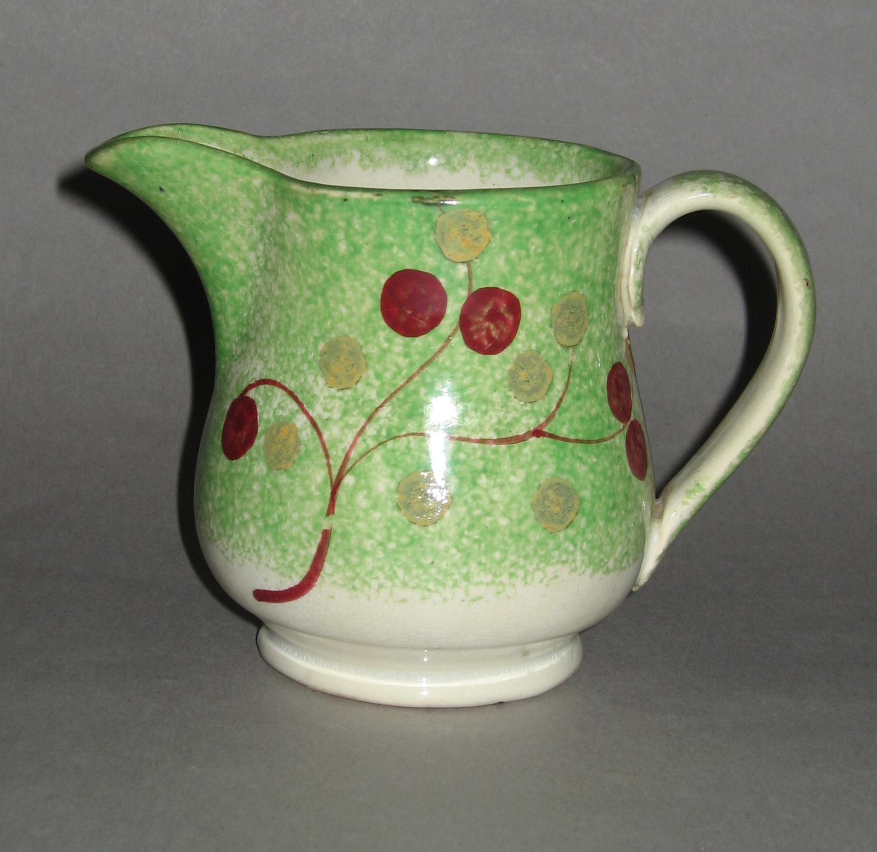 1965.0912.009 Vine and Berry spatterware cream jug