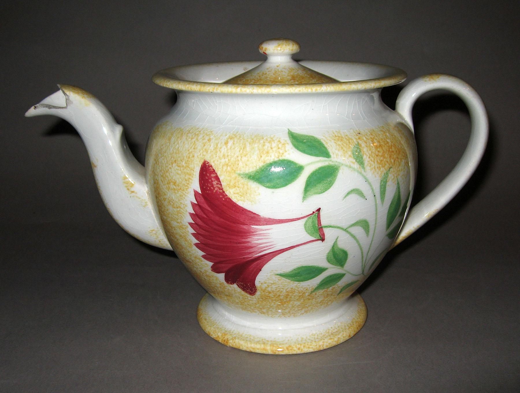1965.0926 A, B Yellow spatterware thistle pattern teapot