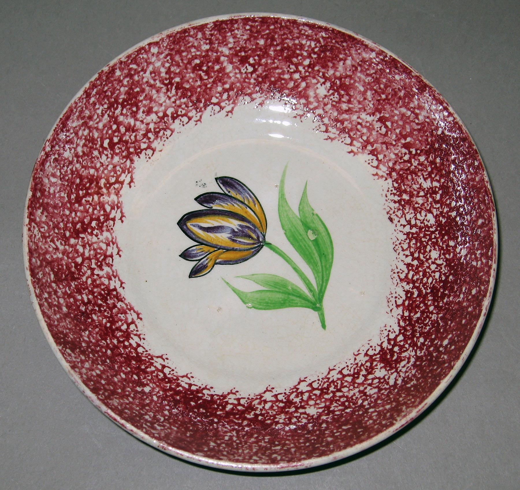 1965.0937.007 Spatterware saucer