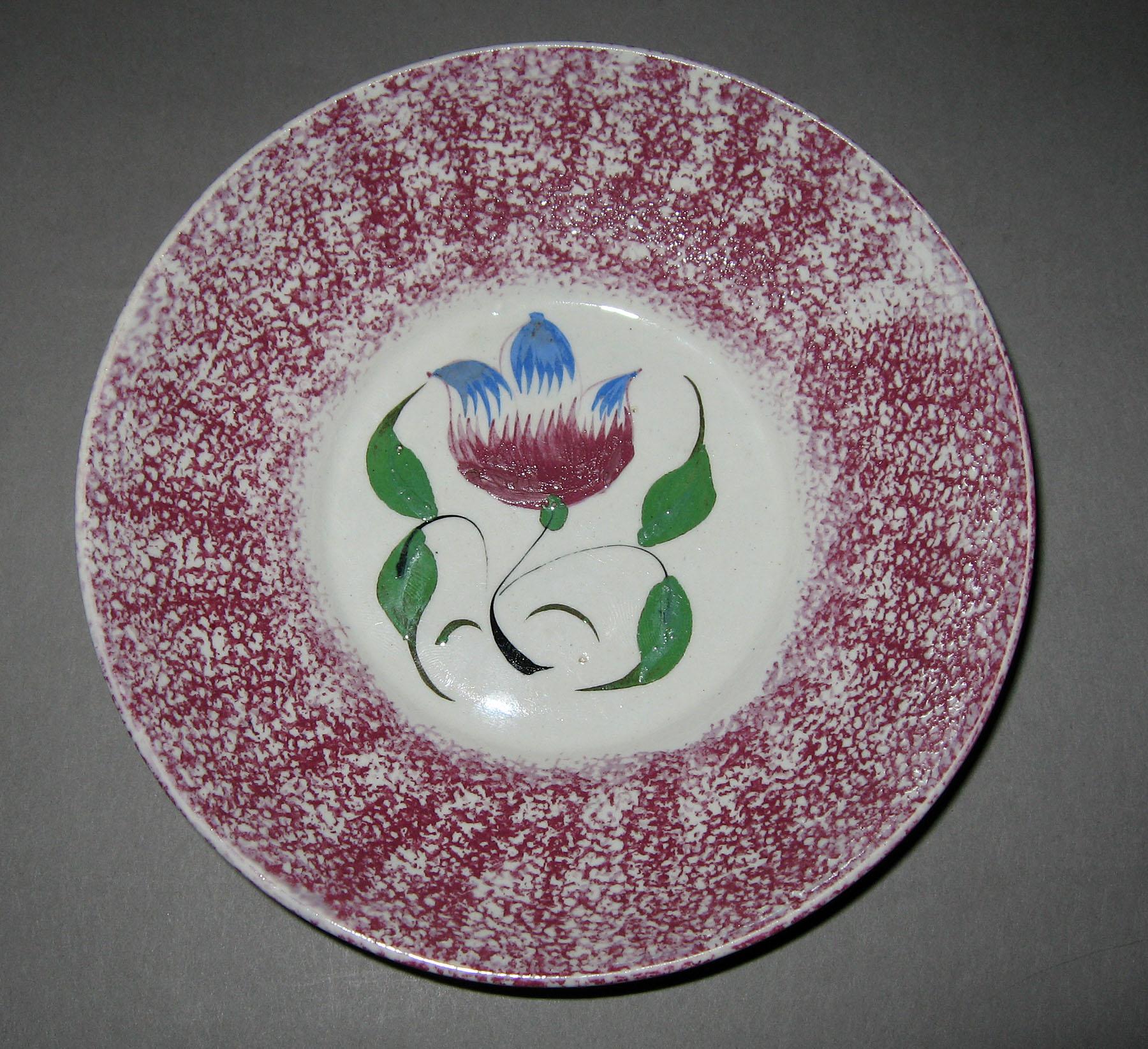 1965.0940 B Pink spatterware tulip pattern saucer