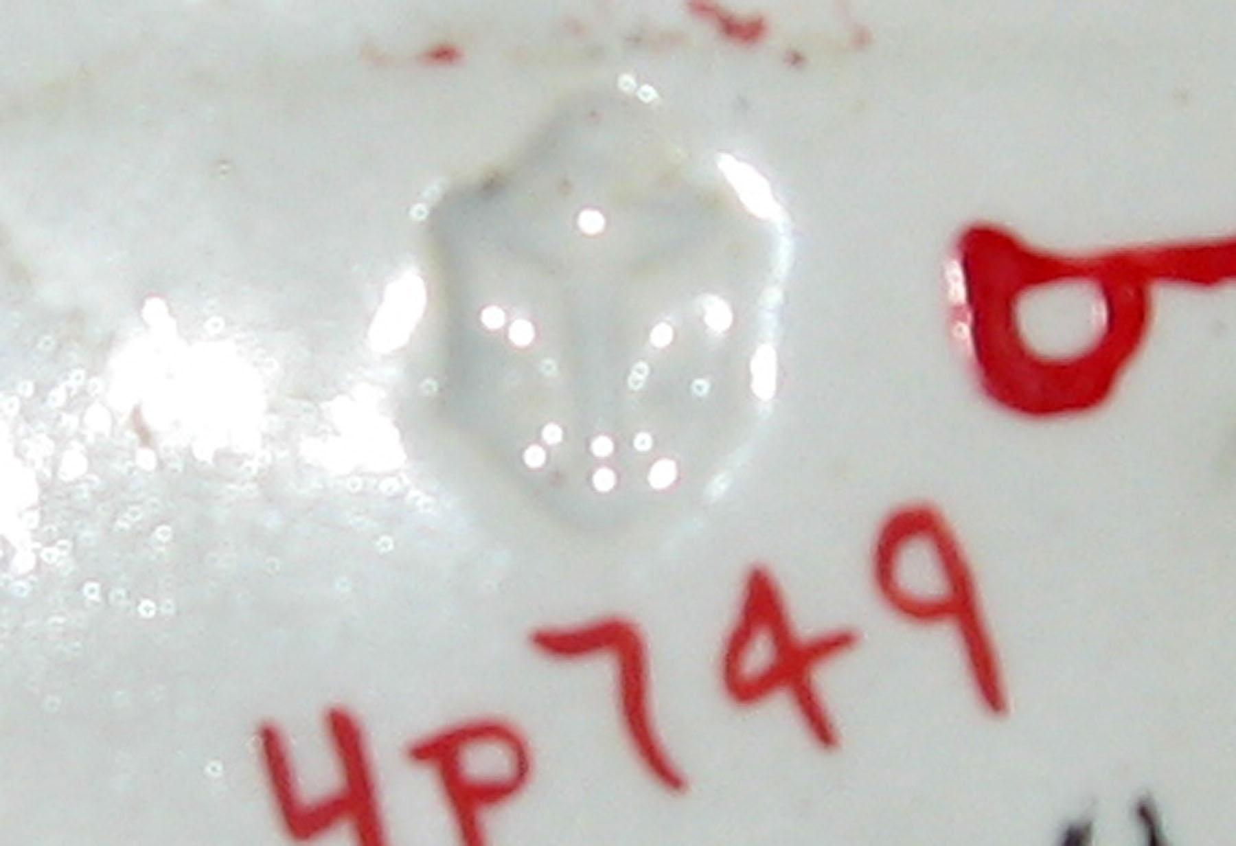 1965.0940 B Pink spatterware tulip pattern saucer (mark)