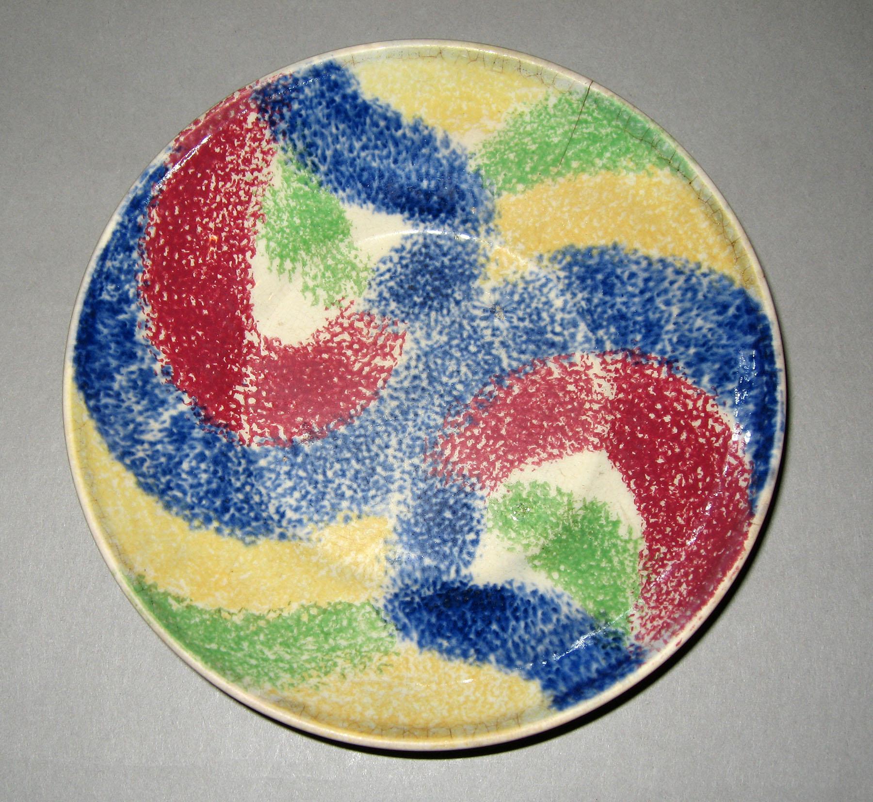 1965.0943 Rainbow undulating pattern saucer