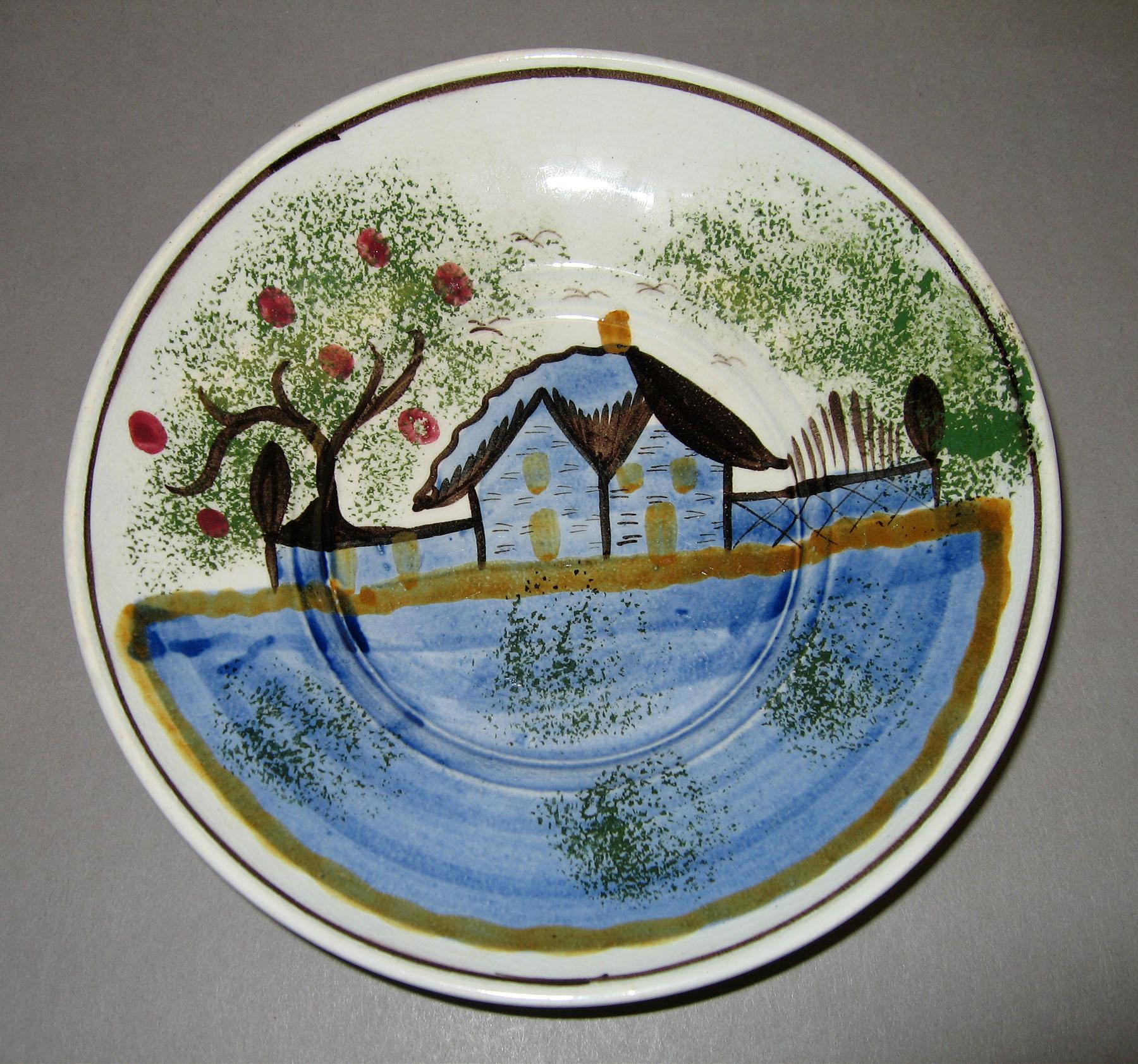 1965.0946.001 Town House pattern spatterware saucer