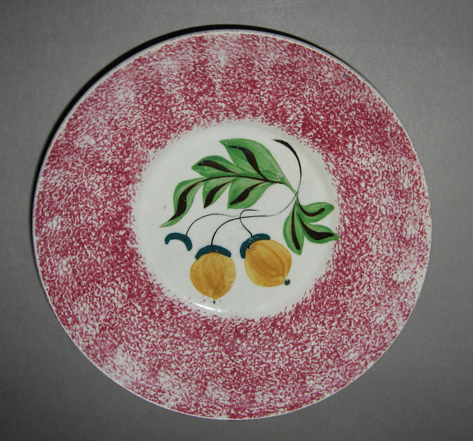 1965.0960 B Pink spatterware acorn pattern saucer