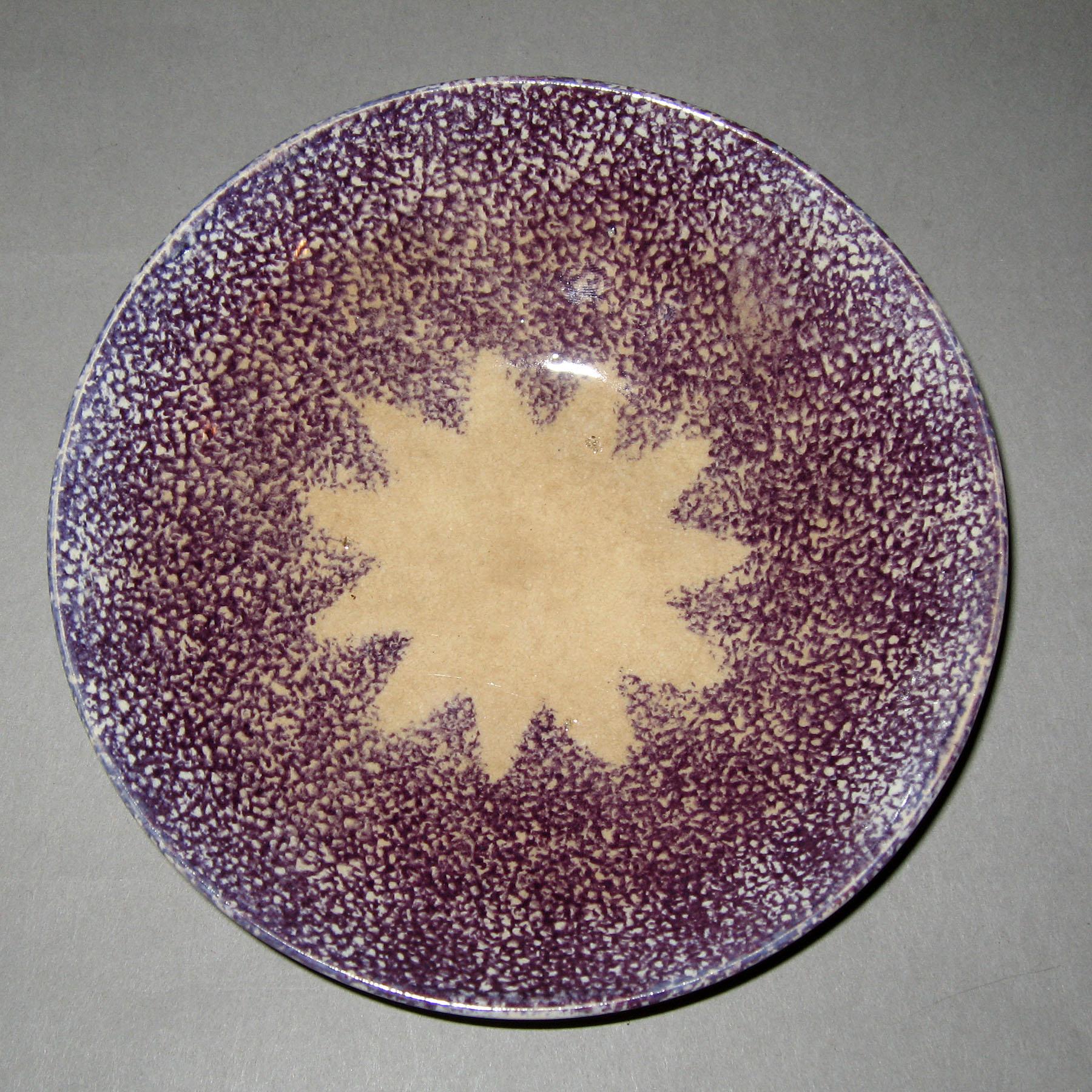 1965.0964 Purple spatterware star saucer