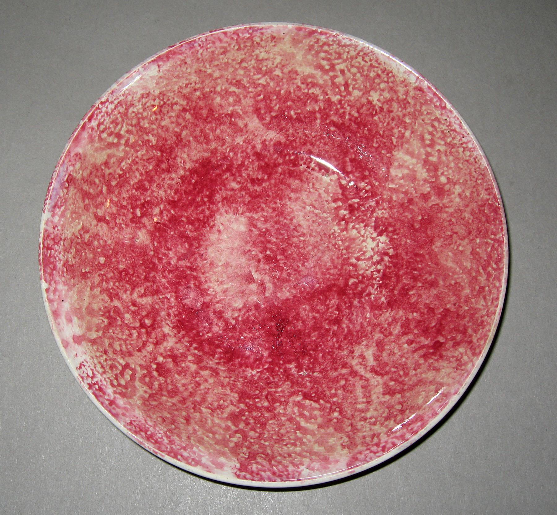 1965.0966 Red spatterware saucer