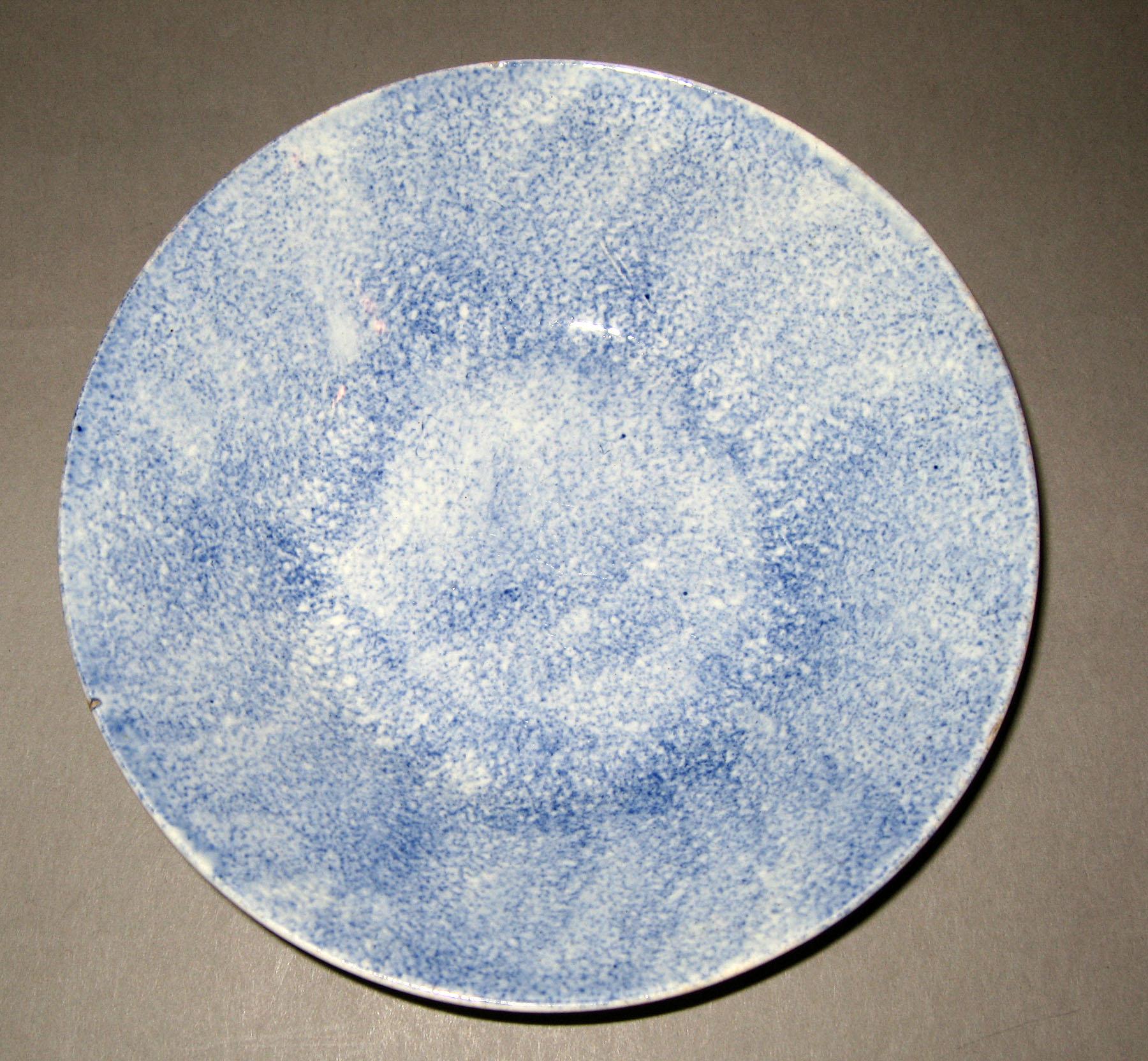 1965.0967 Blue spatterware saucer