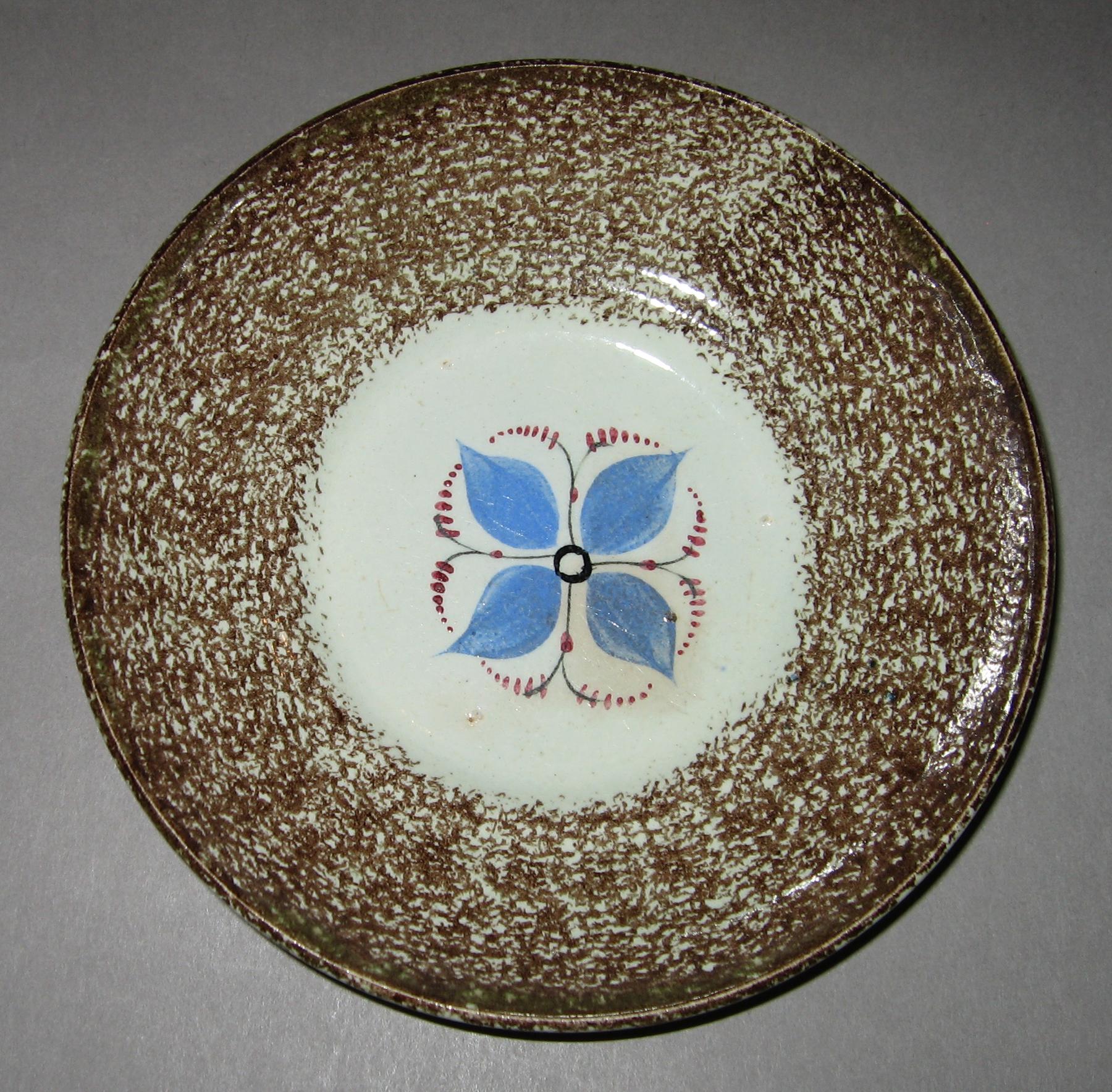1965.0968 B Spatterware saucer