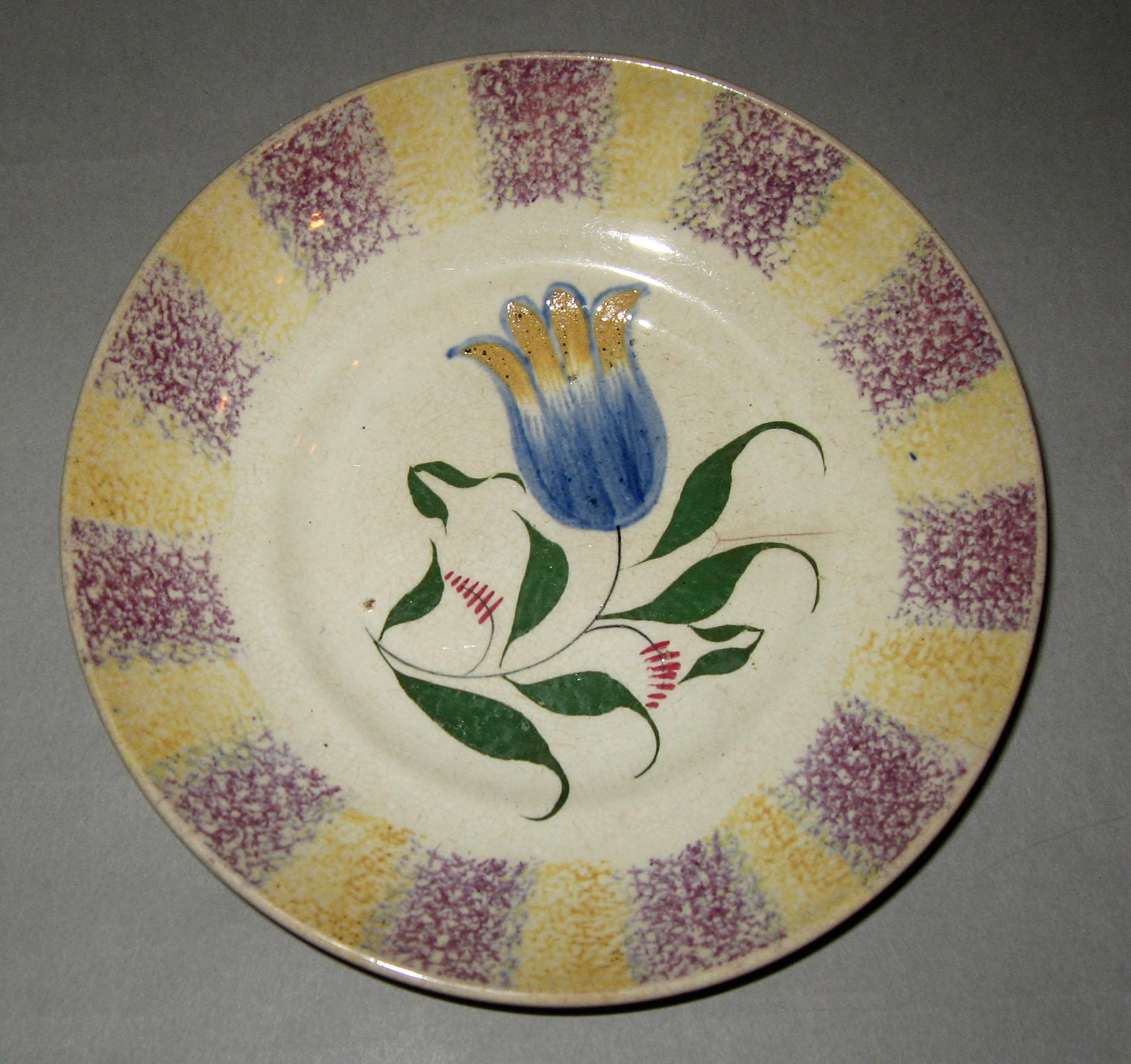 1965.0973 B Purple and yellow tulip spatterware saucer