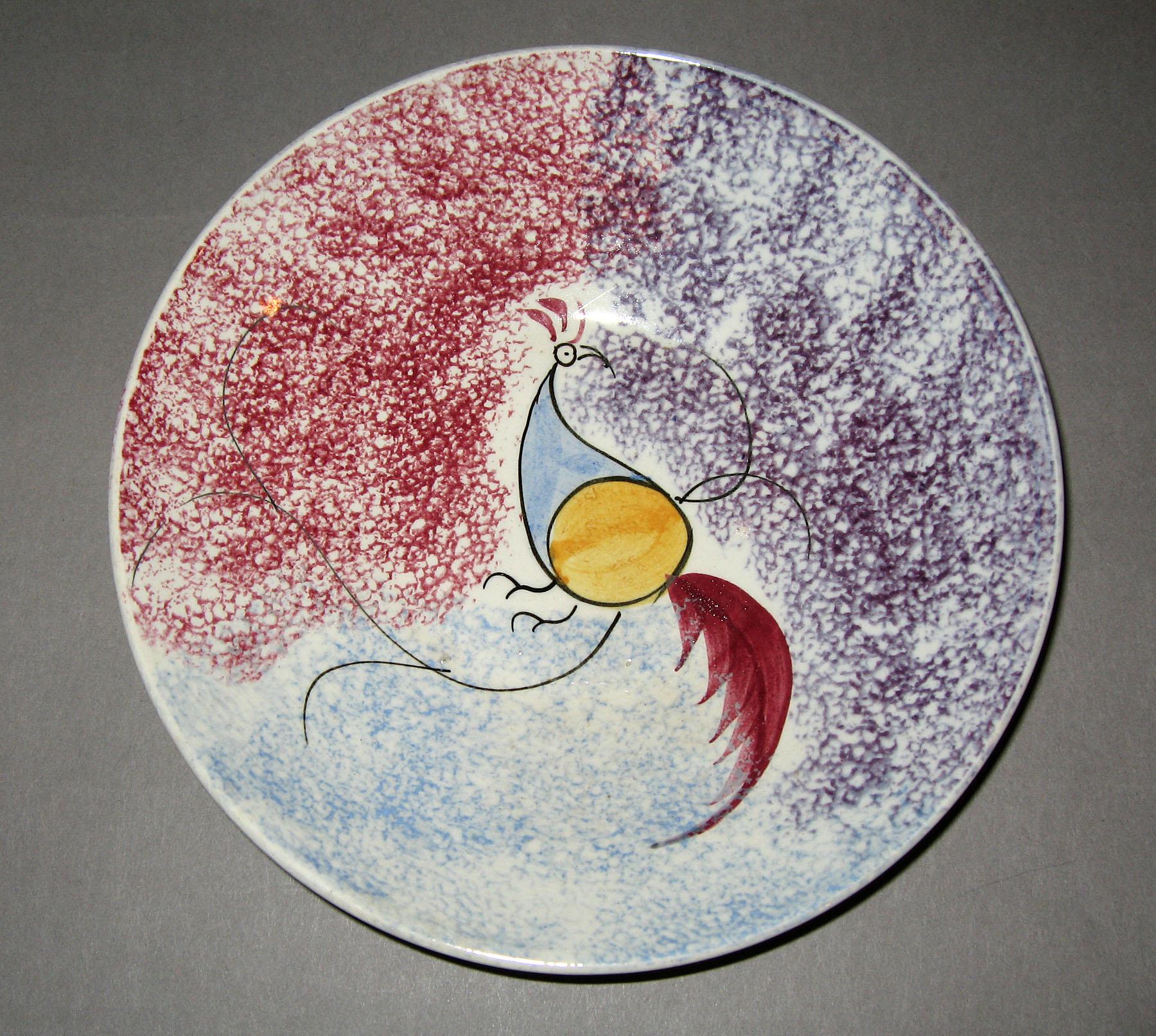 1965.0978 Rainbow spatterware peafowl pattern saucer