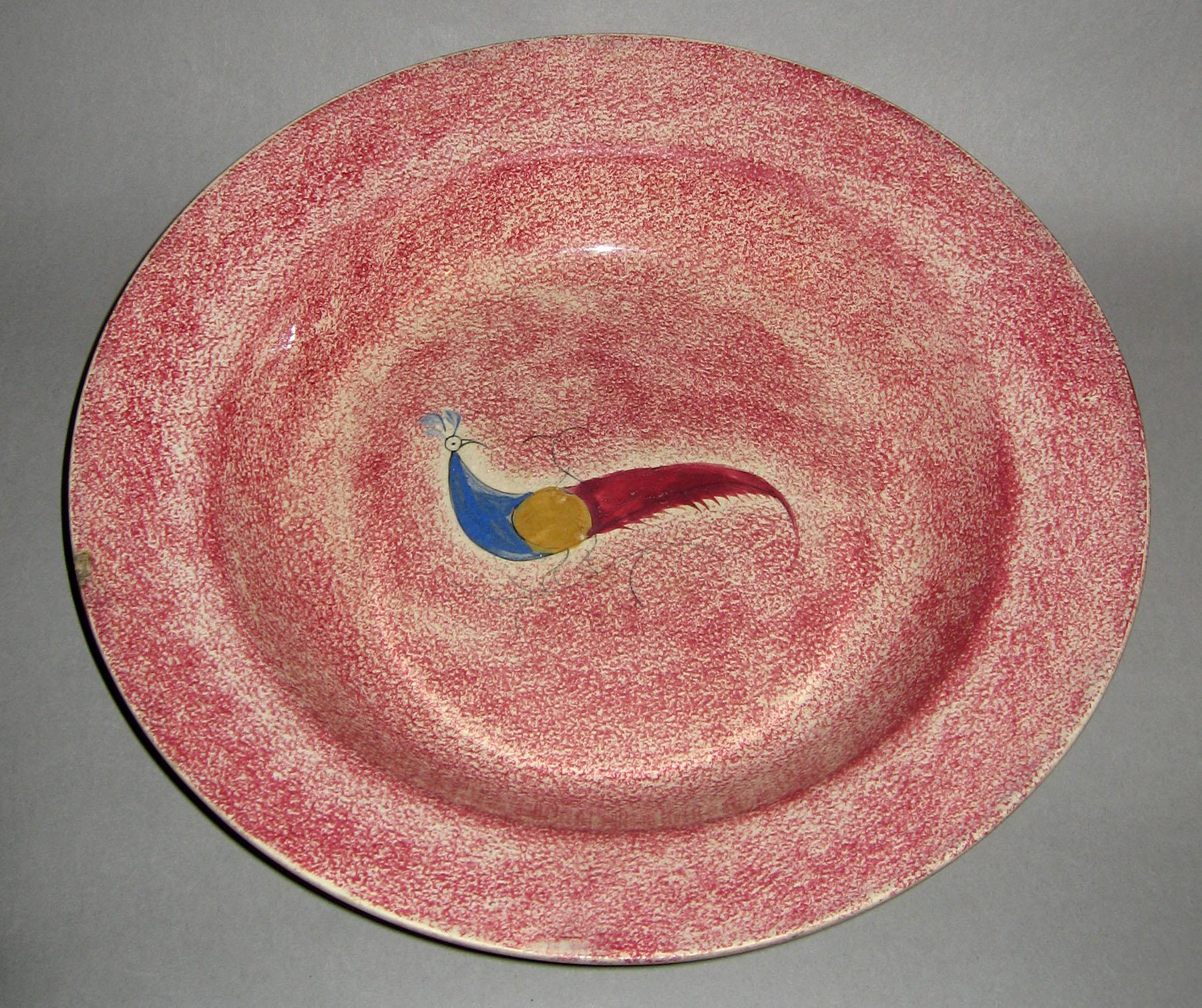 1965.0979 Pink spatterware peafowl soup plate