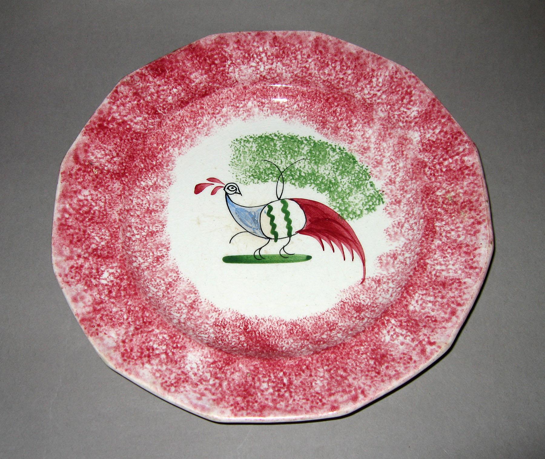 1965.1012.001 Pink spatterware open peafowl plate
