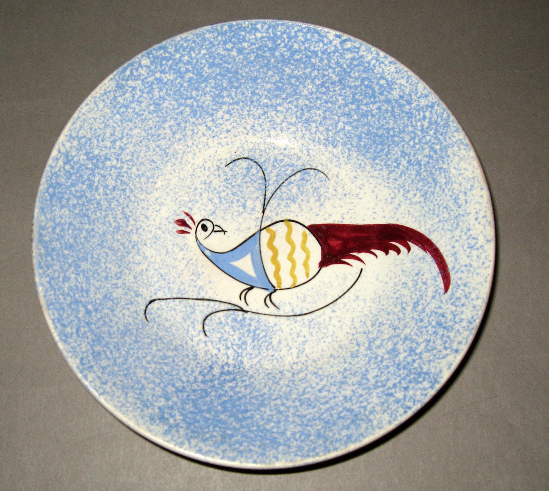 1965.1015 Blue spatterware open peafowl saucer