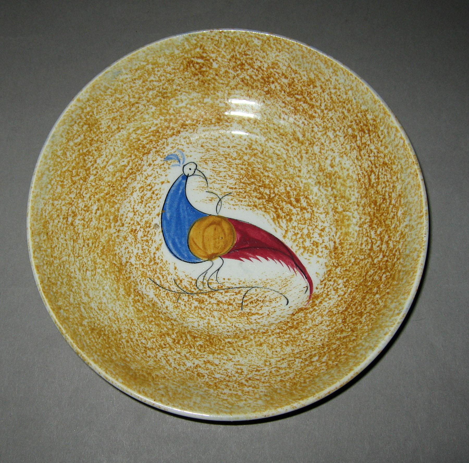 1965.1029 B Yellow spatterware peafowl saucer