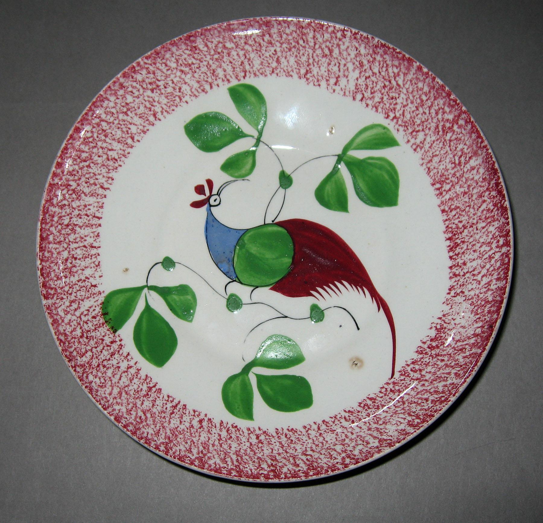 1965.1033 B Pink spatterware and peafowl pattern saucer
