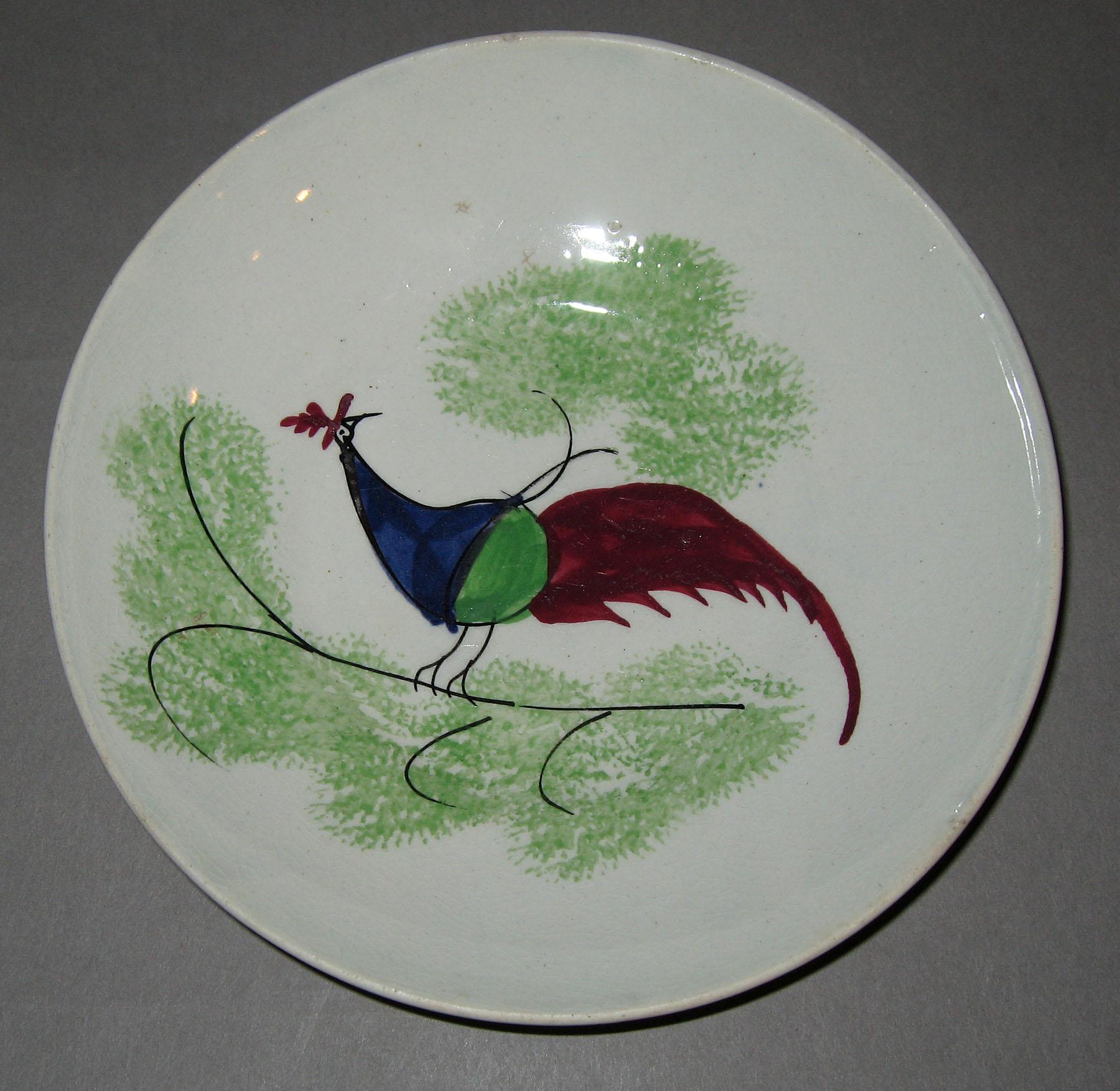 1965.1037 Green spatterware peafowl saucer