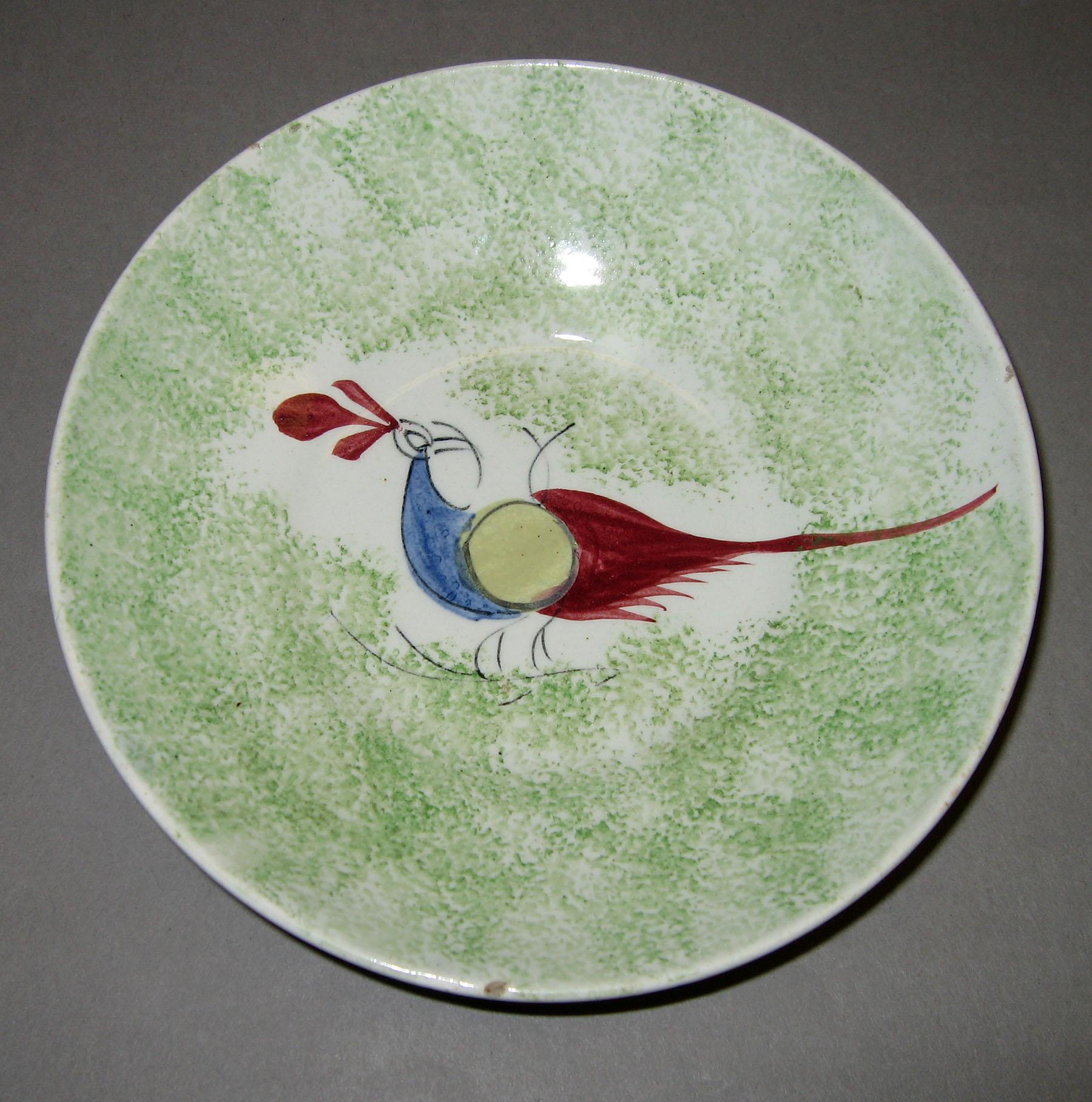1965.1053.002 Green spatter peafowl saucer