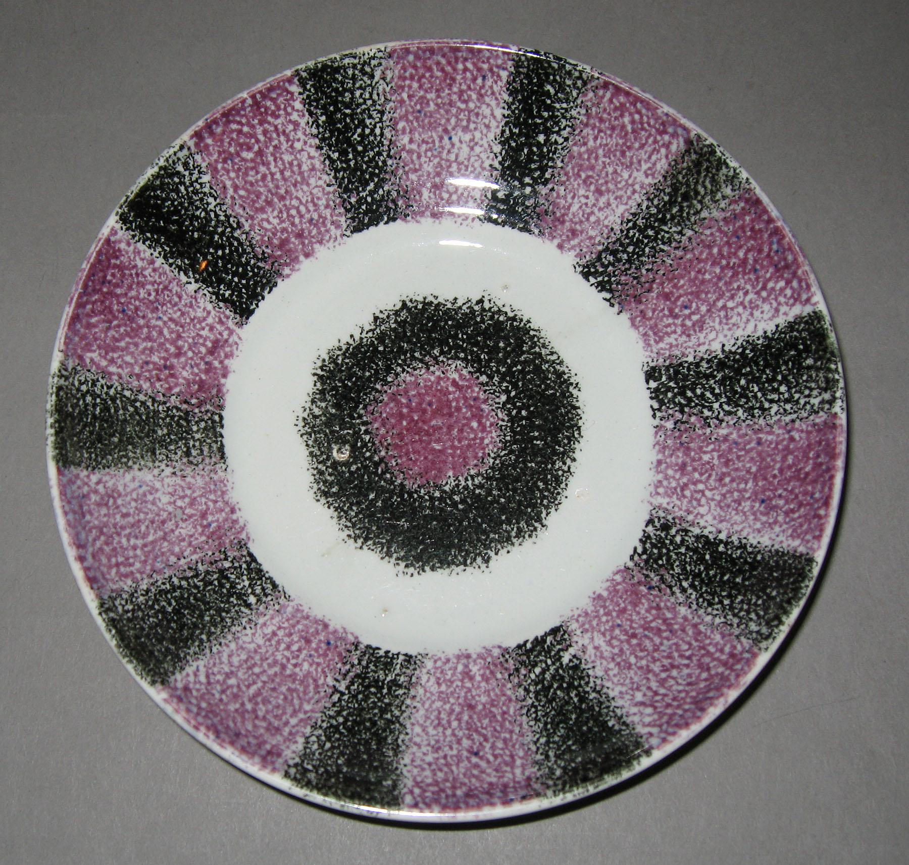 1965.1093 B Black and purple spatterware stripe saucer