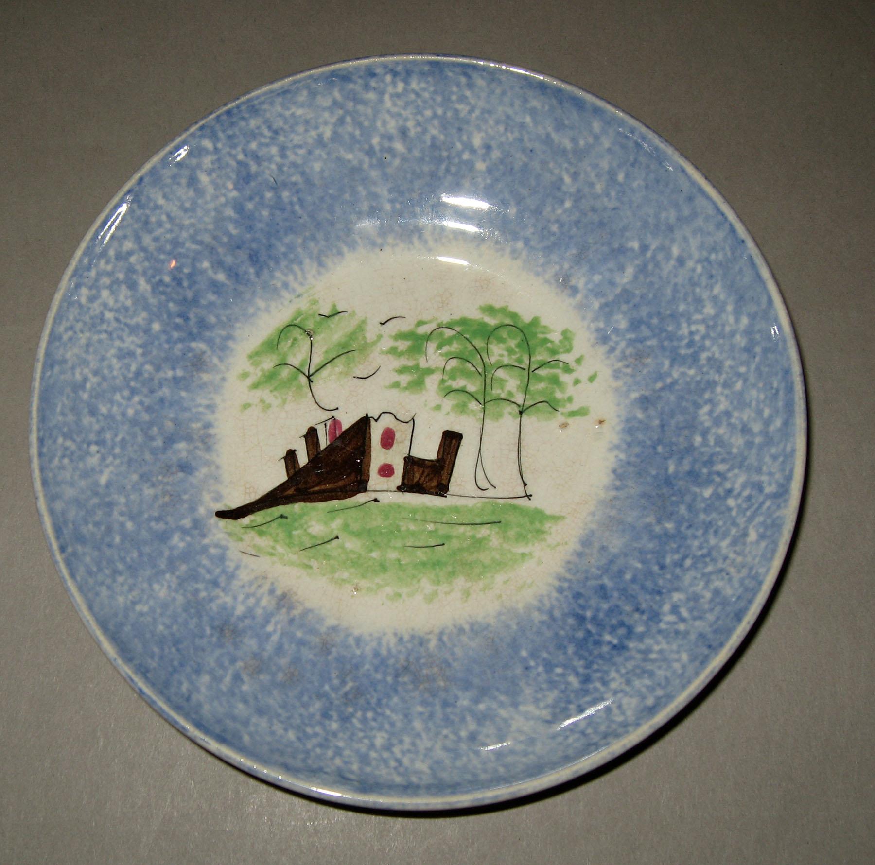1965.1103 Blue spatterware with castle pattern saucer