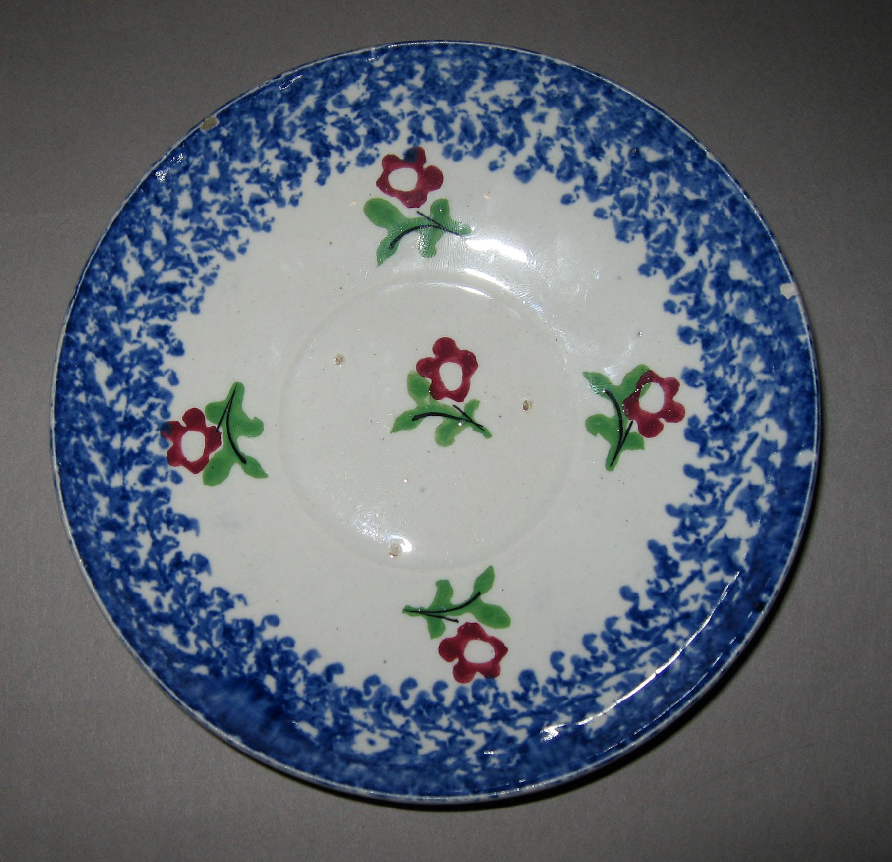 1965.1104 B Cut sponge flower blue spatterware saucer