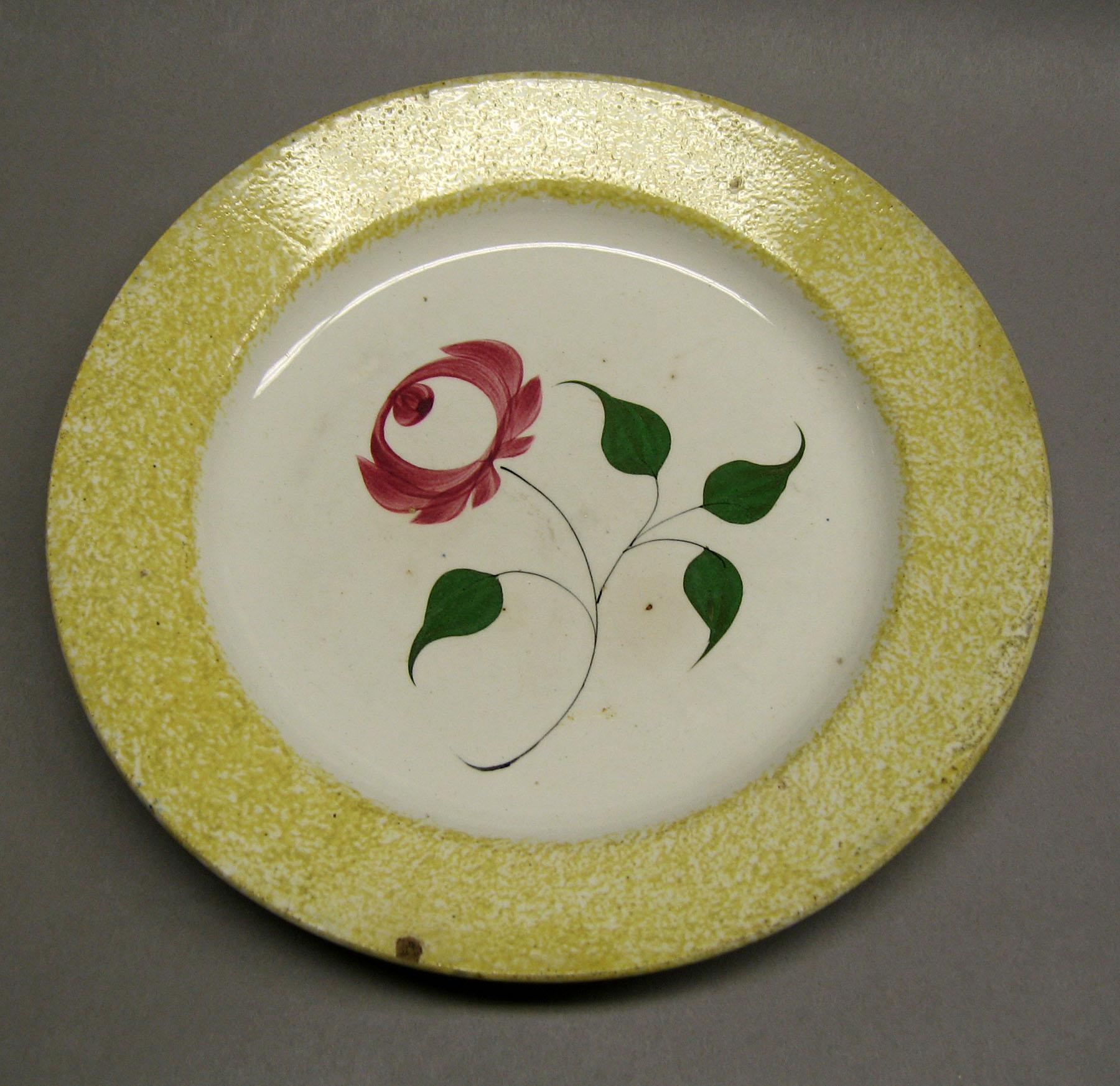 1965.1120 Yellow spatter rose pattern plate