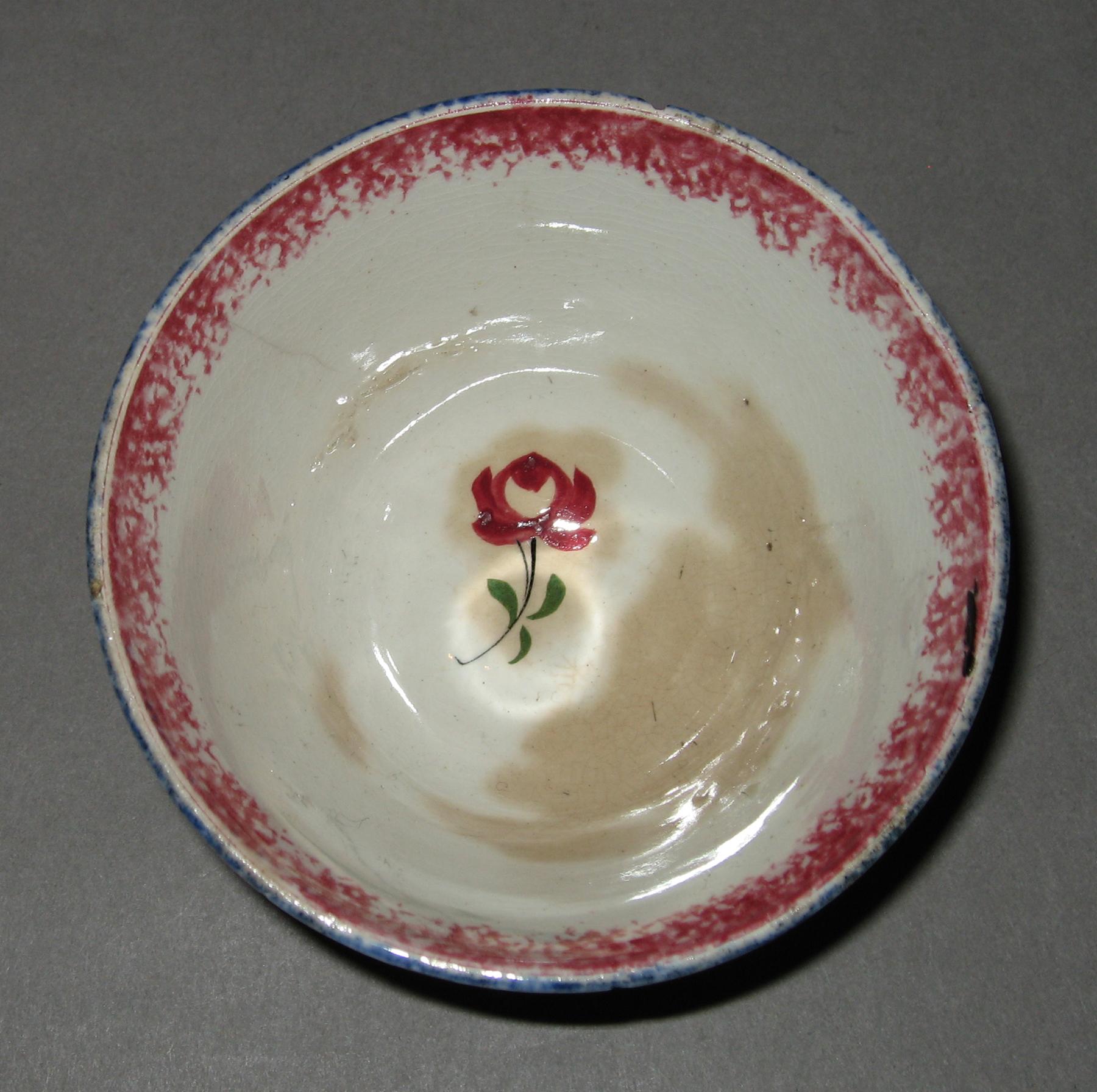 1965.1131.001 Adams rose pattern spatterware teabowl (interior)