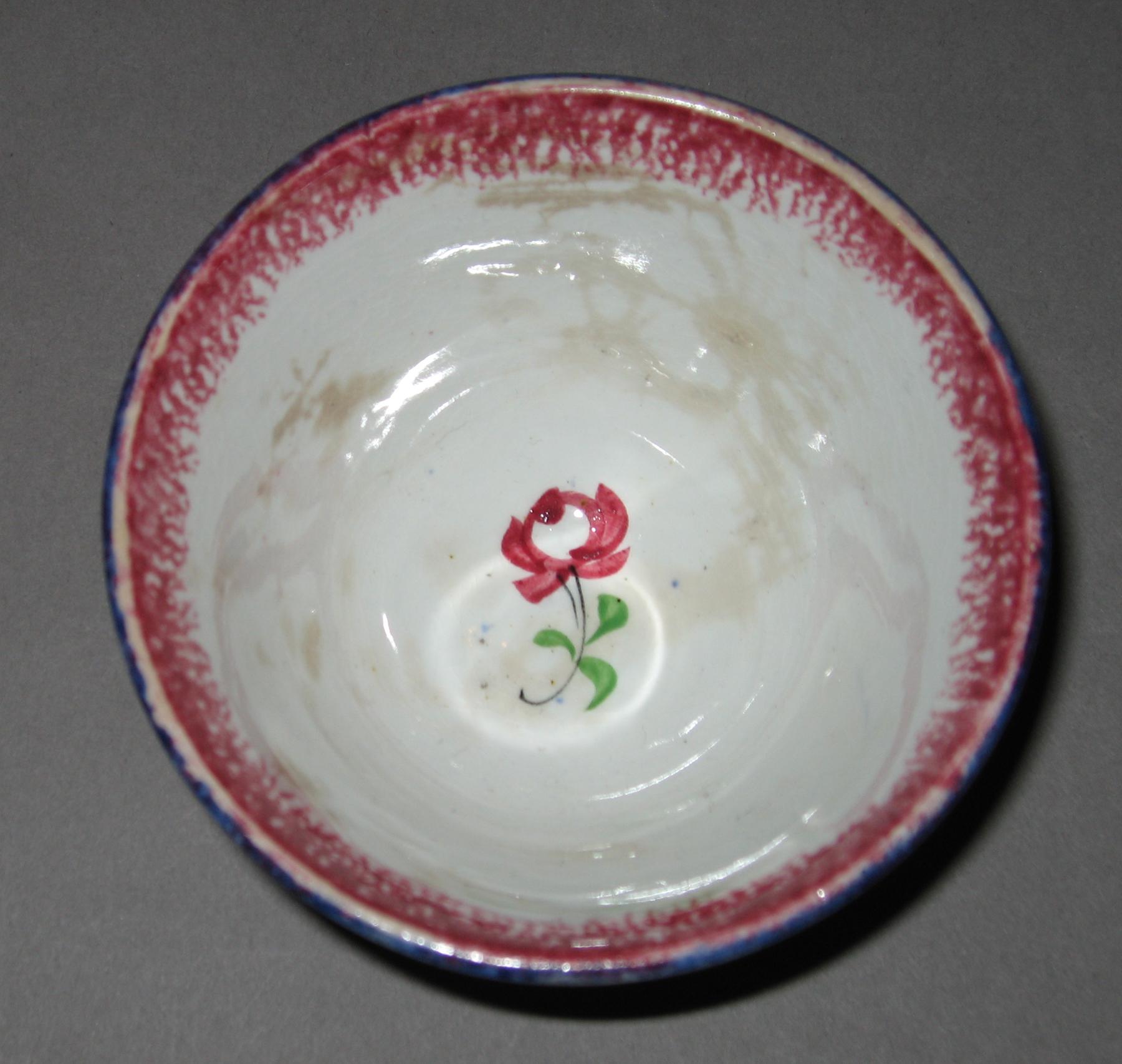 1965.1131.002 Adams rose pattern spatterware teabowl (interior)