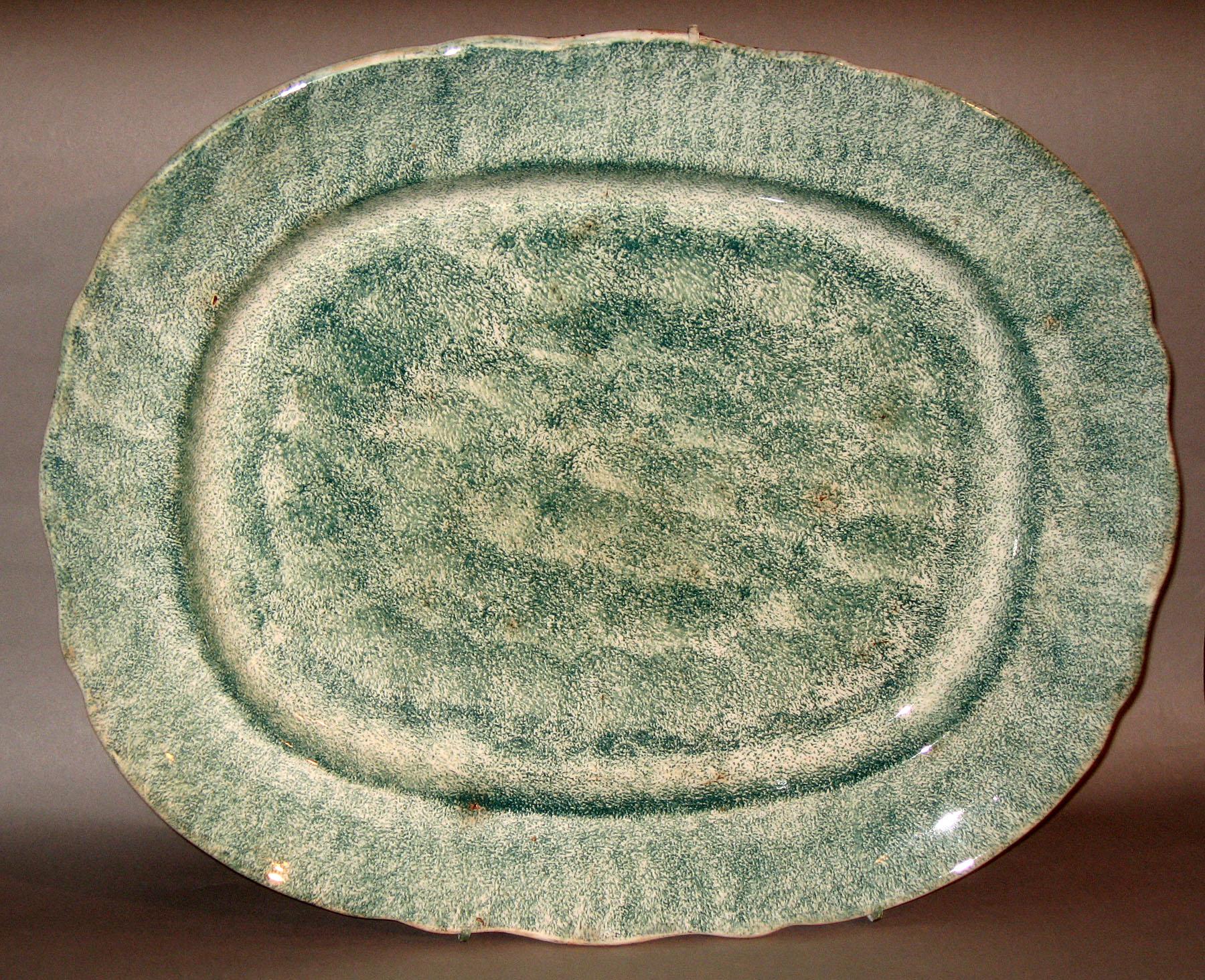 1965.1142 Green spatterware dish