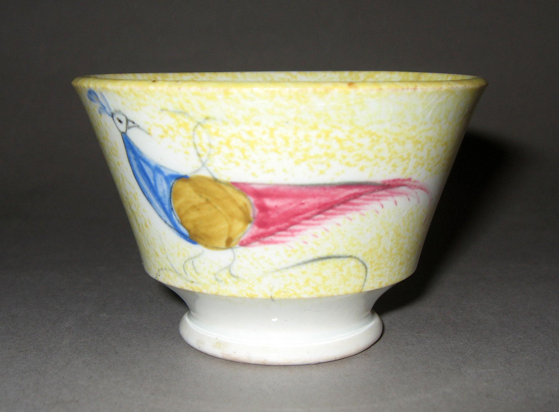 1965.1152 Yellow spatterware teabowl