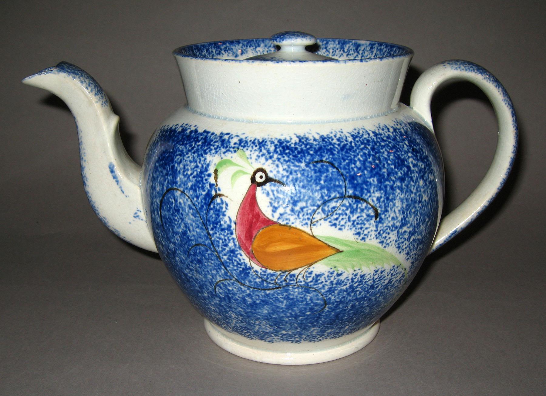 1965.1155 A, B Blue spatterware and peafowl teapot