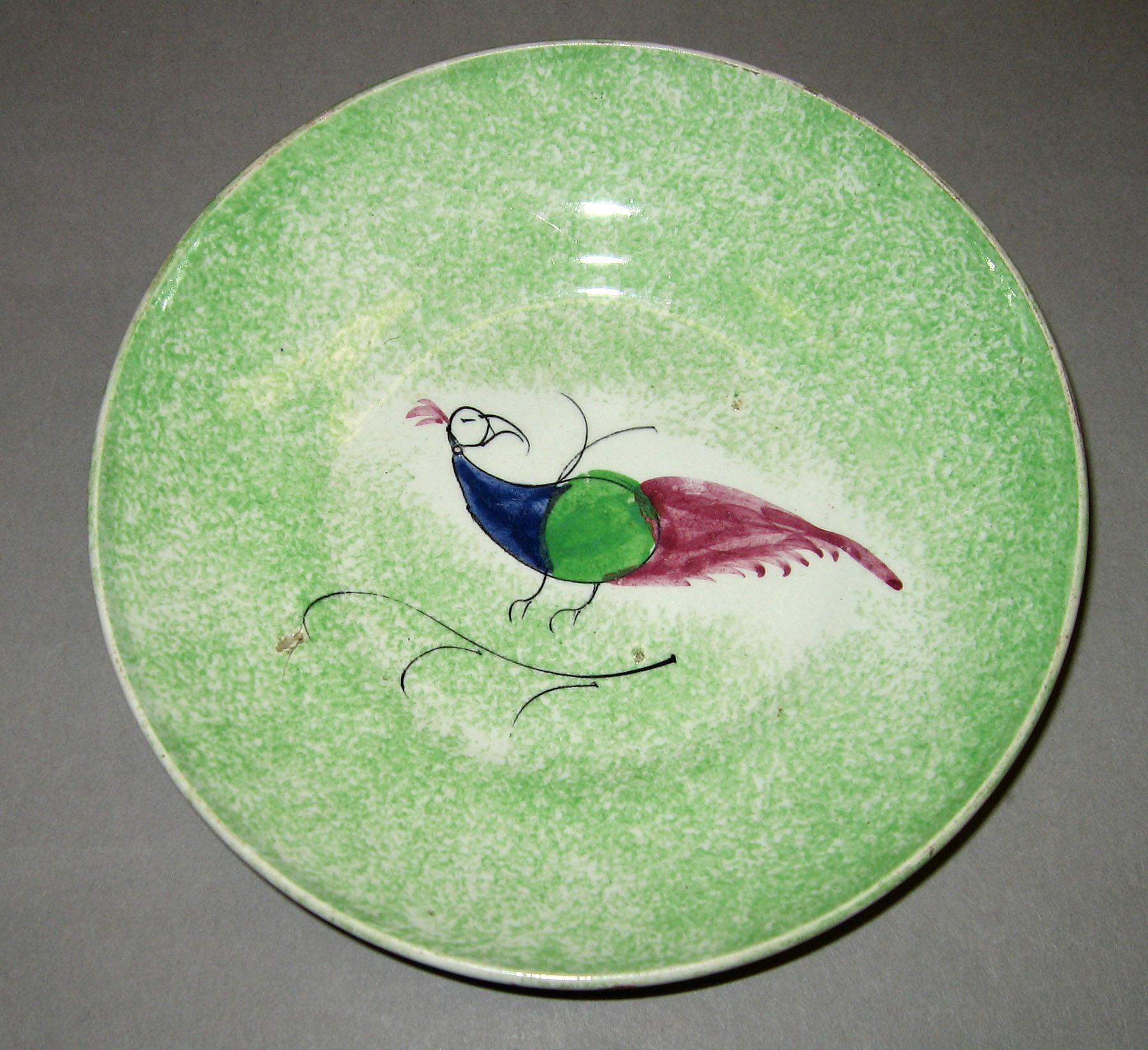 1965.1176.002 Green spatter peafowl saucer
