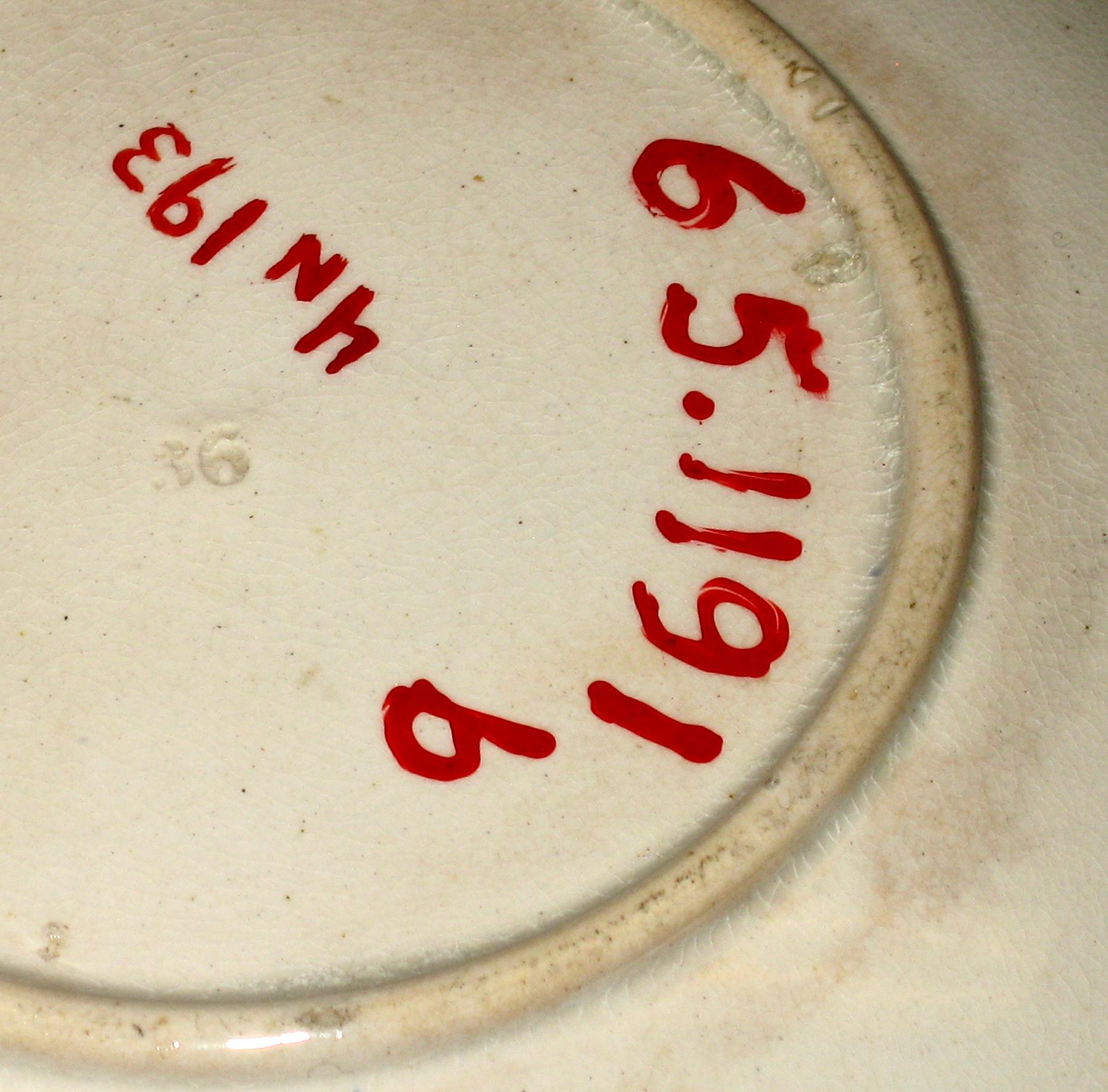 1965.1191 B Earthenware saucer (mark)