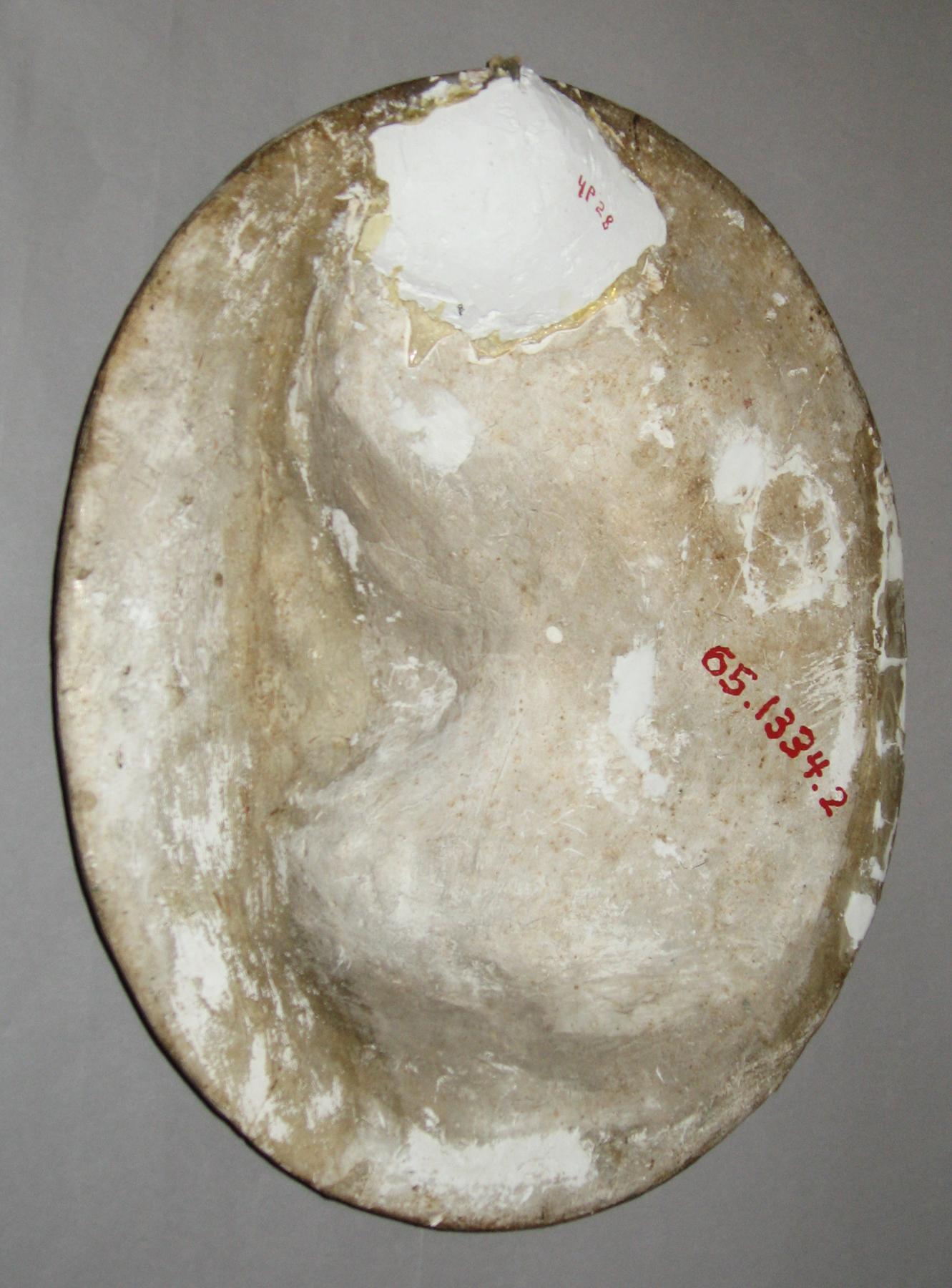 1965.1334.002 Chalkware female portrait plaque (back)