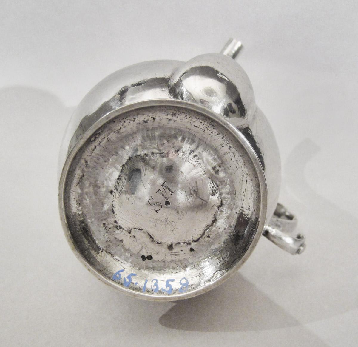 1965.1358 A Spout cup, underside