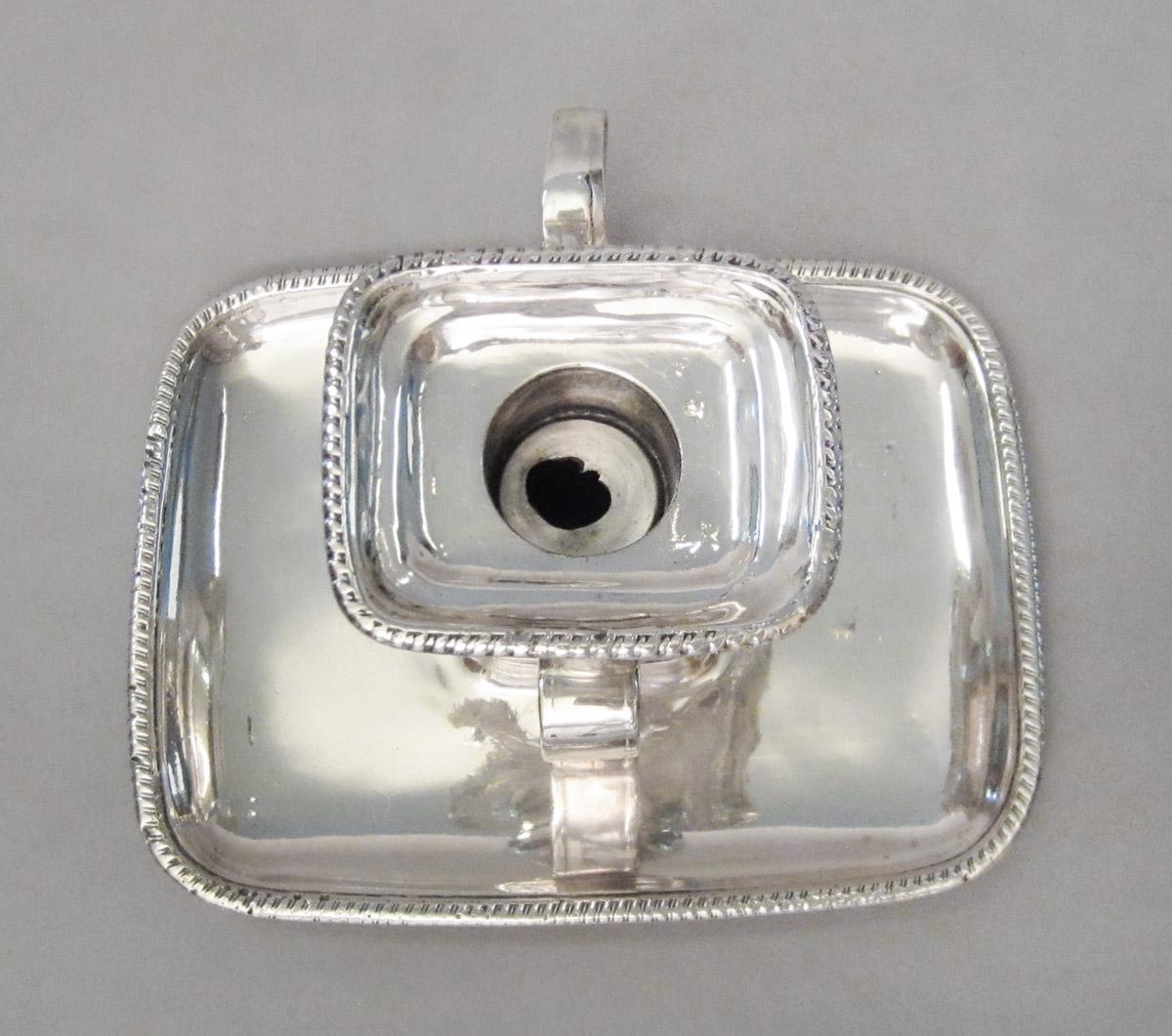 1965.1413 A, B Candlestick, upper surface