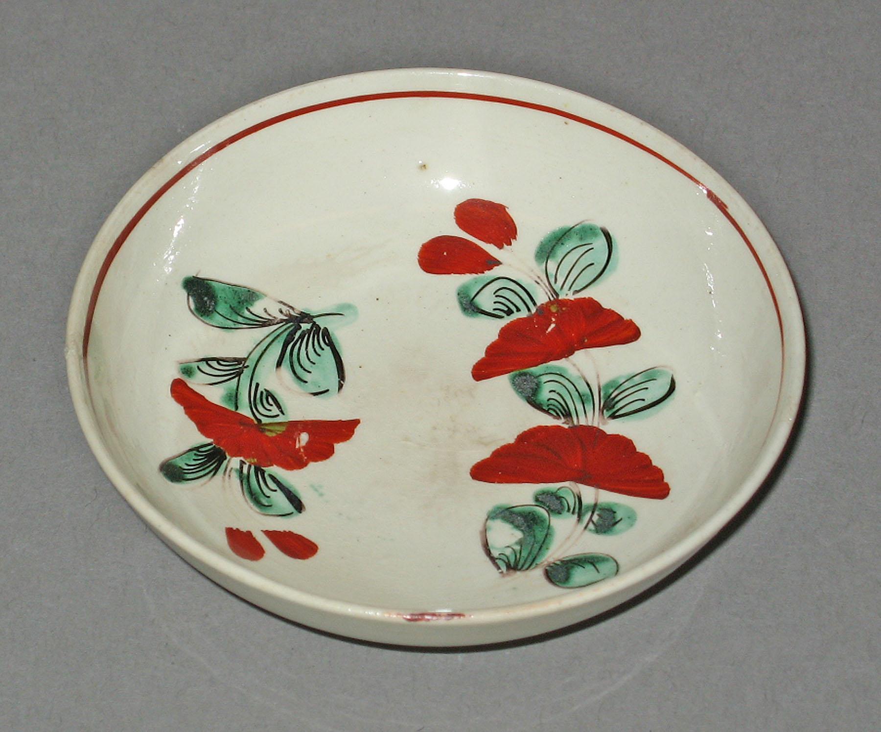 1965.1430.001 Creamware saucer