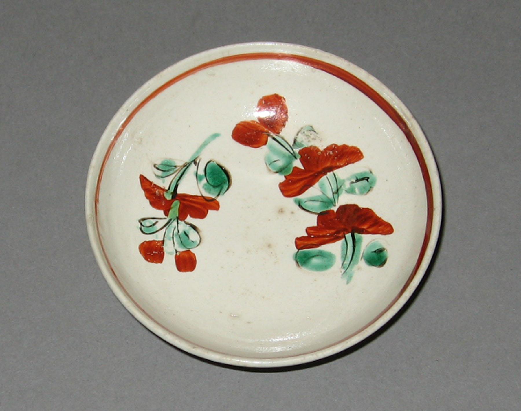 1965.1430.003 Creamware saucer