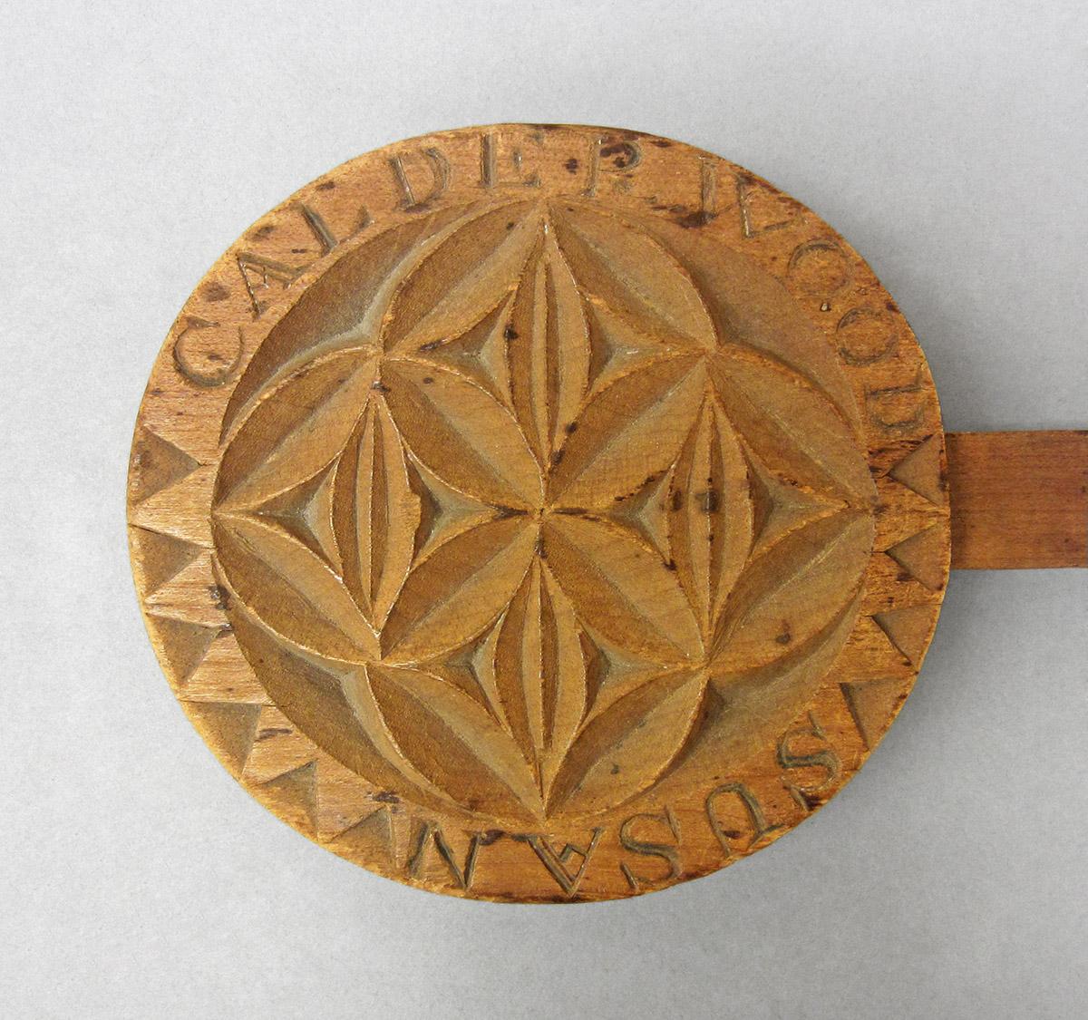 1965.1820, Butter mold, head side 1