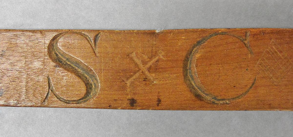 1965.1820, Butter mold, handle side 1