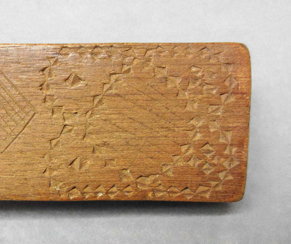 1965.1820, Butter mold, handle carving detail 1